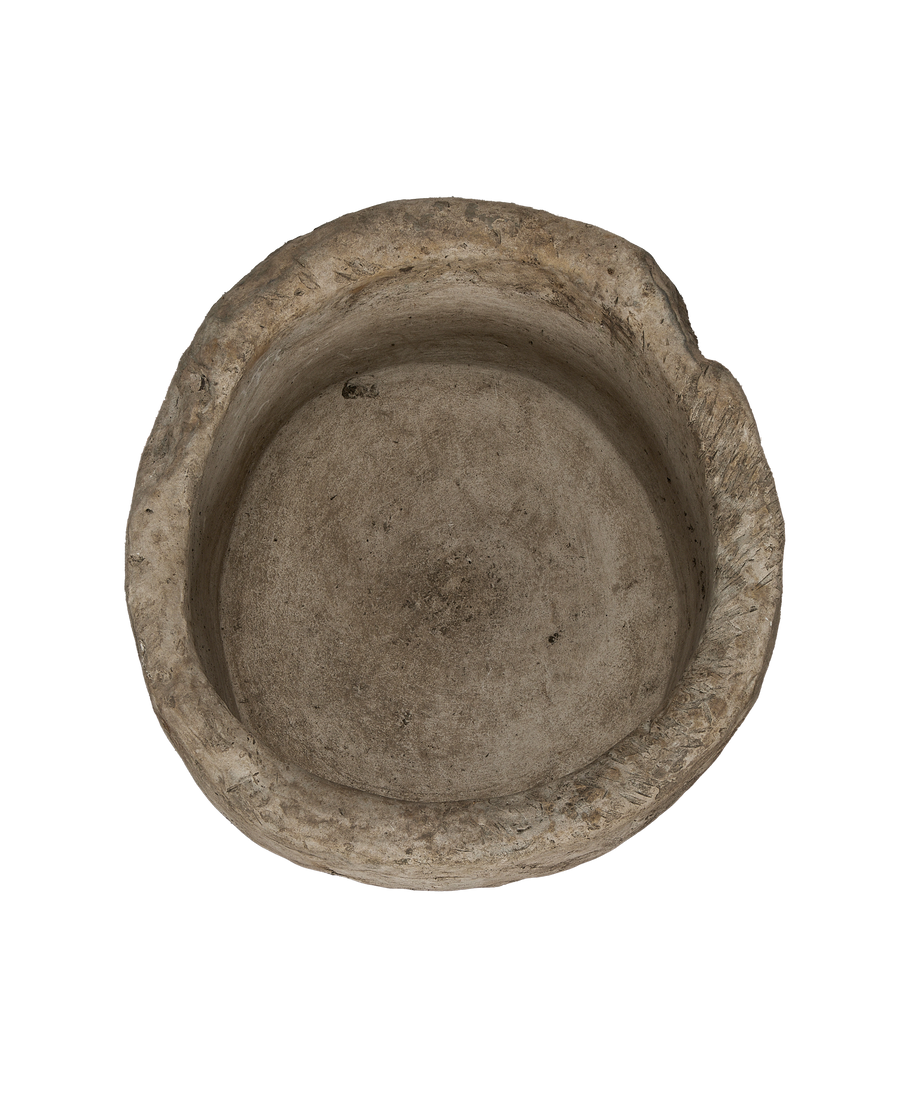 Vintage Indonesian round limestone trough, top-down view showing interior basin texture.
