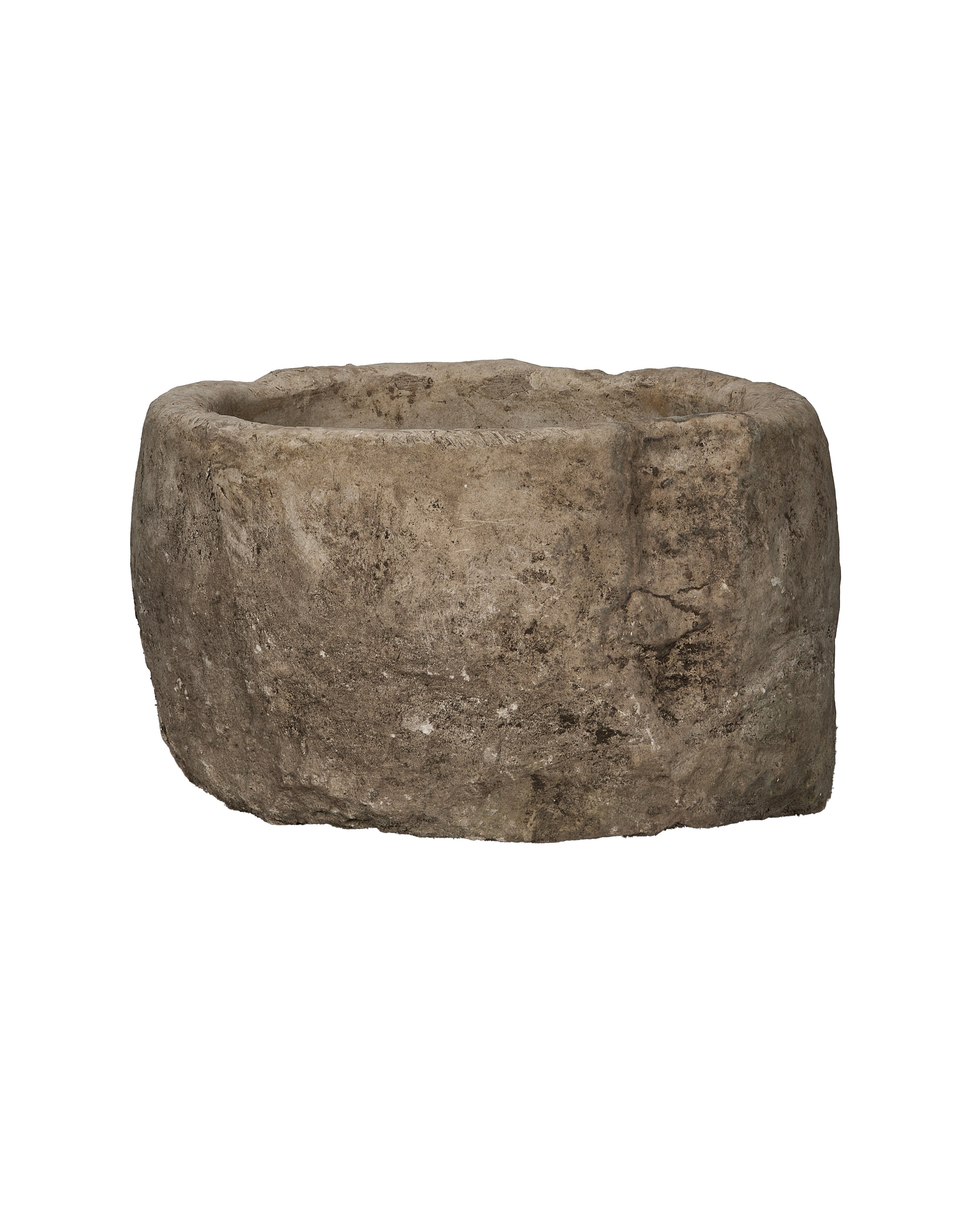 Vintage Indonesian limestone trough, round, showing detailed texture and weathered condition from side perspective.