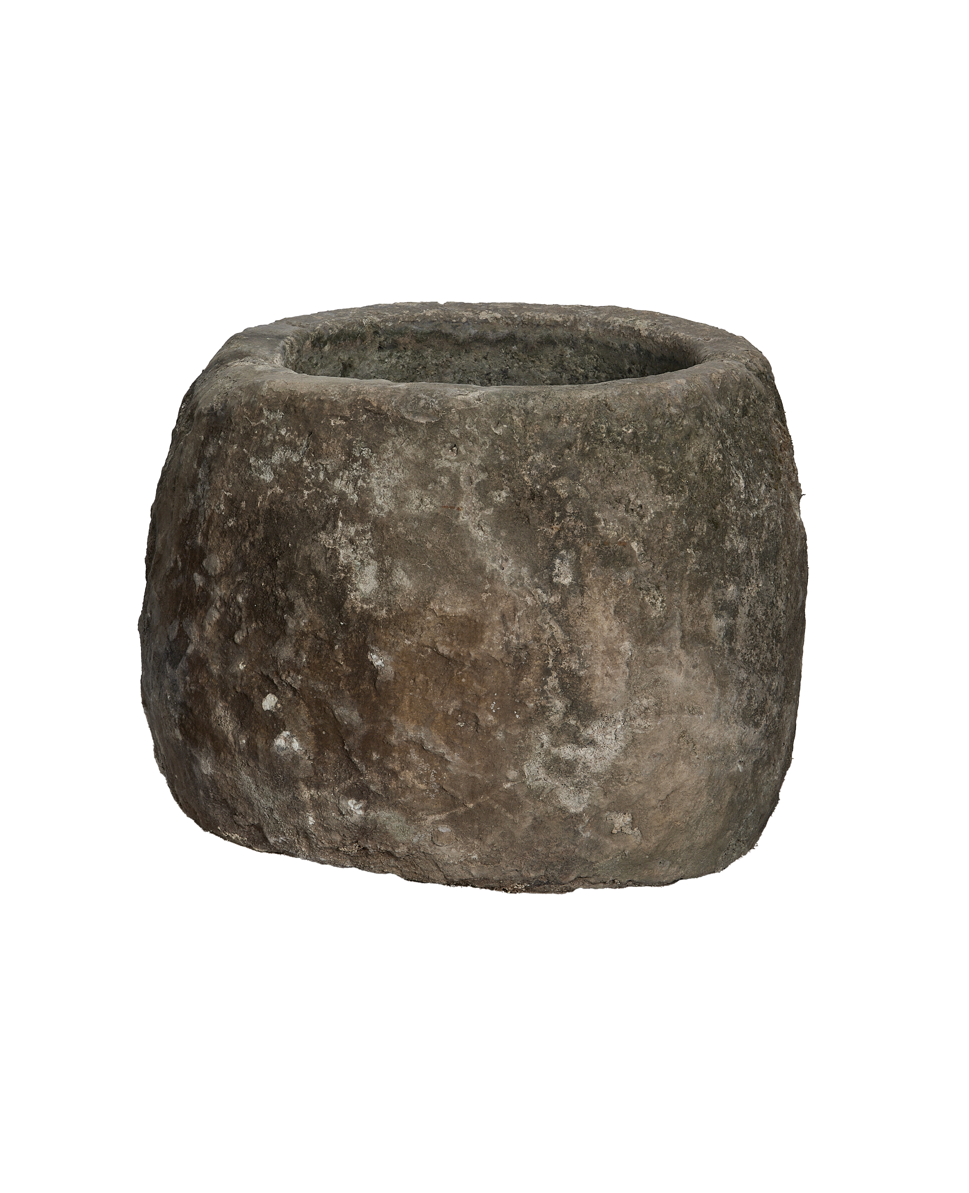 Vintage Indonesian round limestone trough, showing its rough, weathered exterior texture.