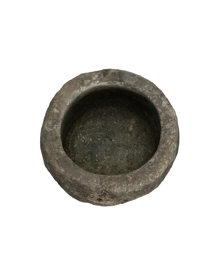 Vintage Indonesian round limestone trough, top view showcasing rough interior texture.