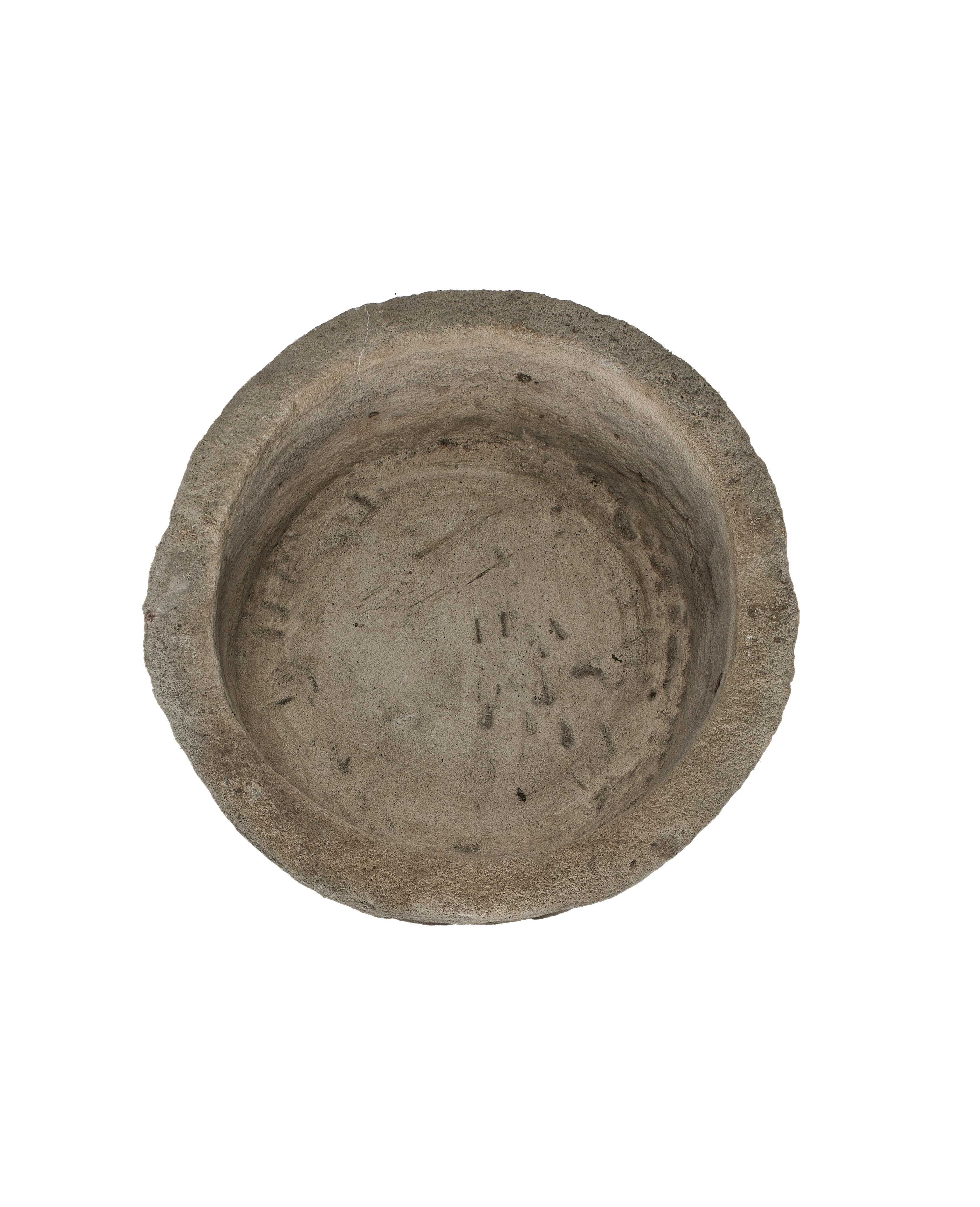 Vintage Indonesian round limestone trough, top-down view showing interior texture and aged surface.