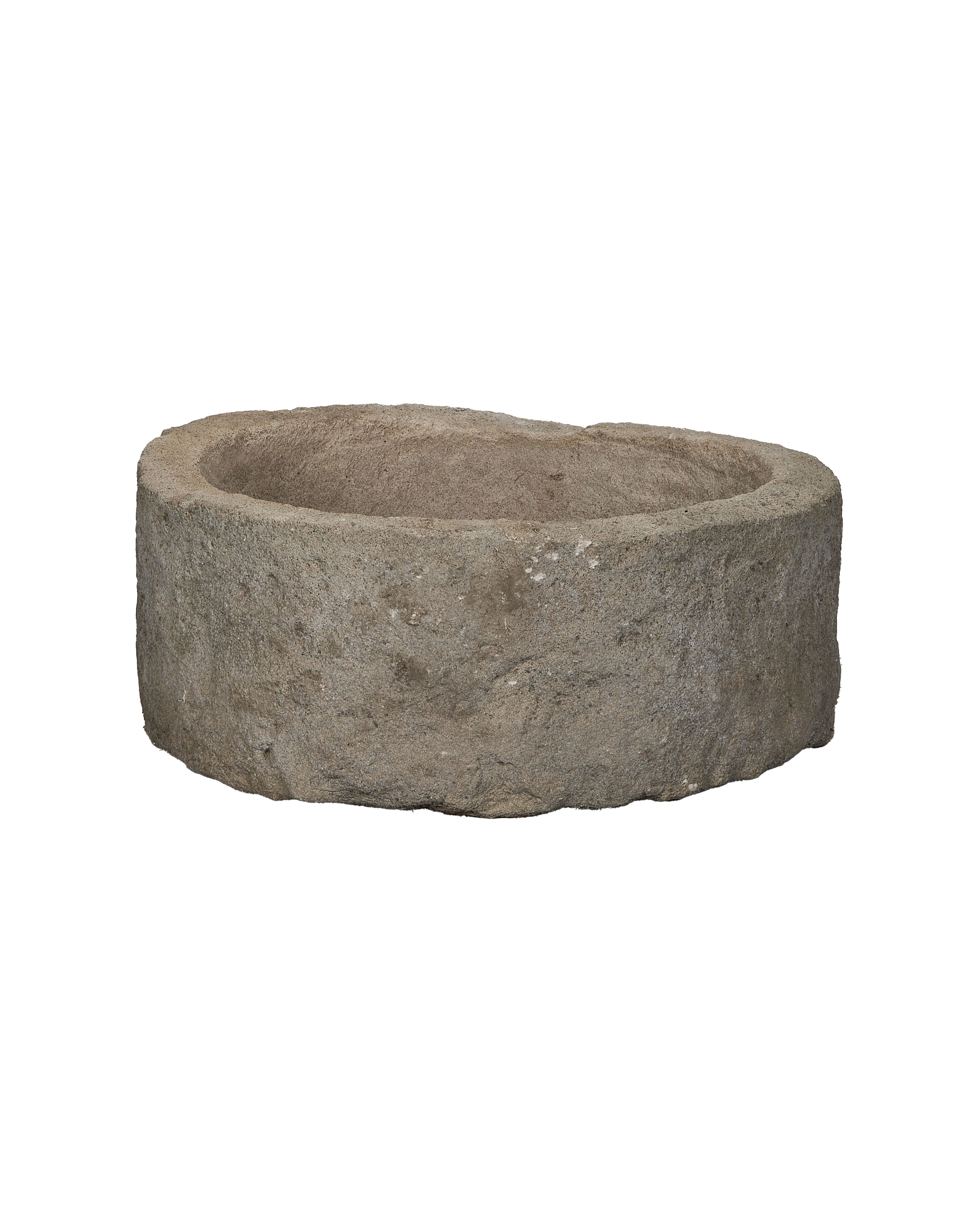Aged Indonesian limestone trough, vintage outdoor planter with rough, textured surface, full view.