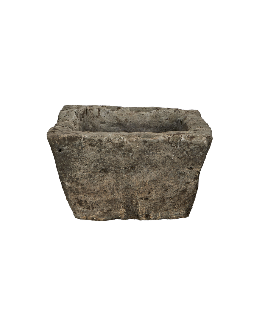Vintage Indonesian limestone trough, square shape, showing rugged texture and interior depth.