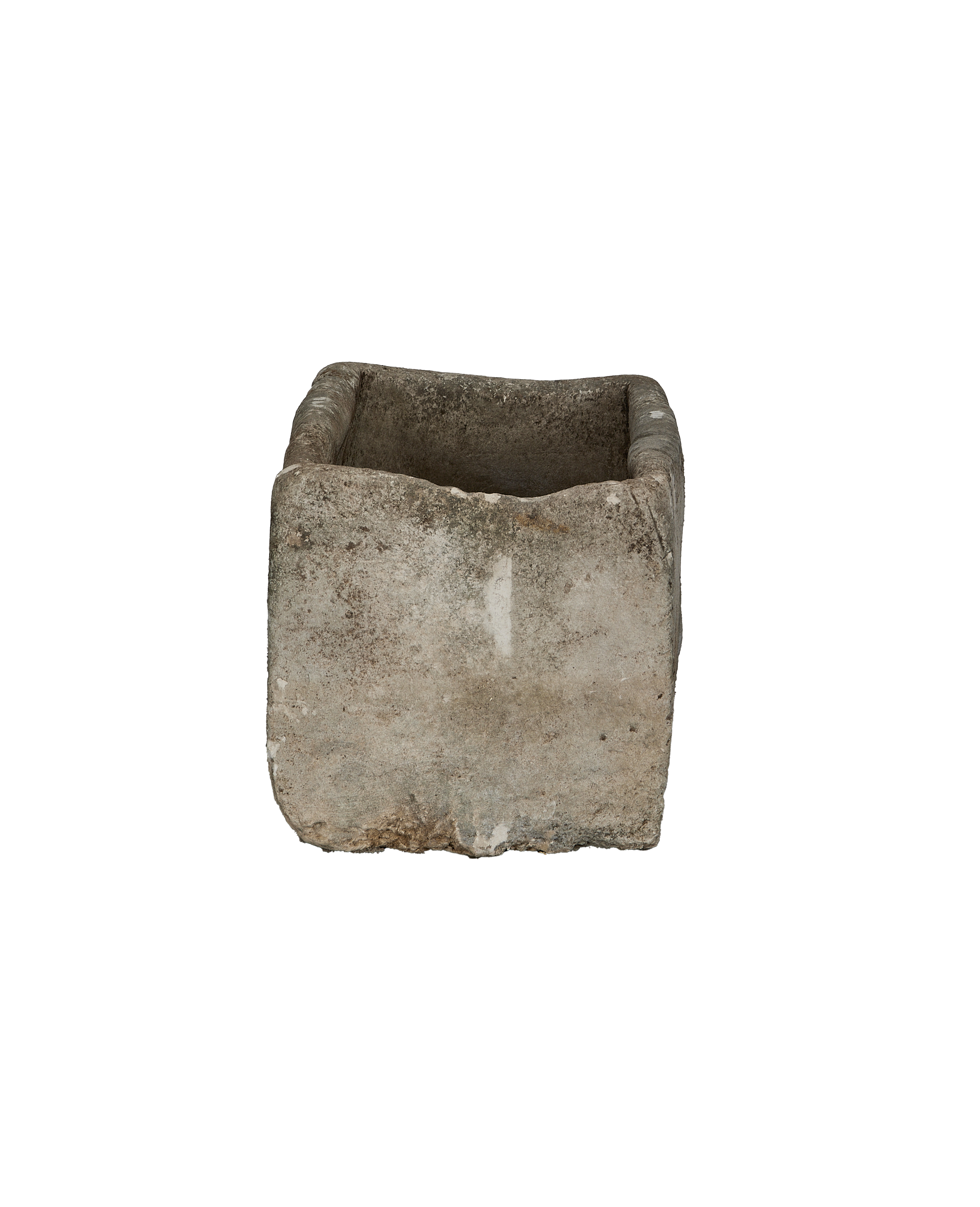 Vintage Indonesian limestone trough, showing weathered texture and square interior from an overhead angle.