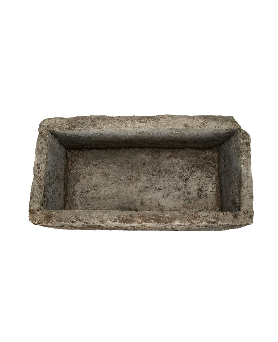 Vintage Indonesian limestone trough (OAK), top-down view showing rectangular, weathered interior.