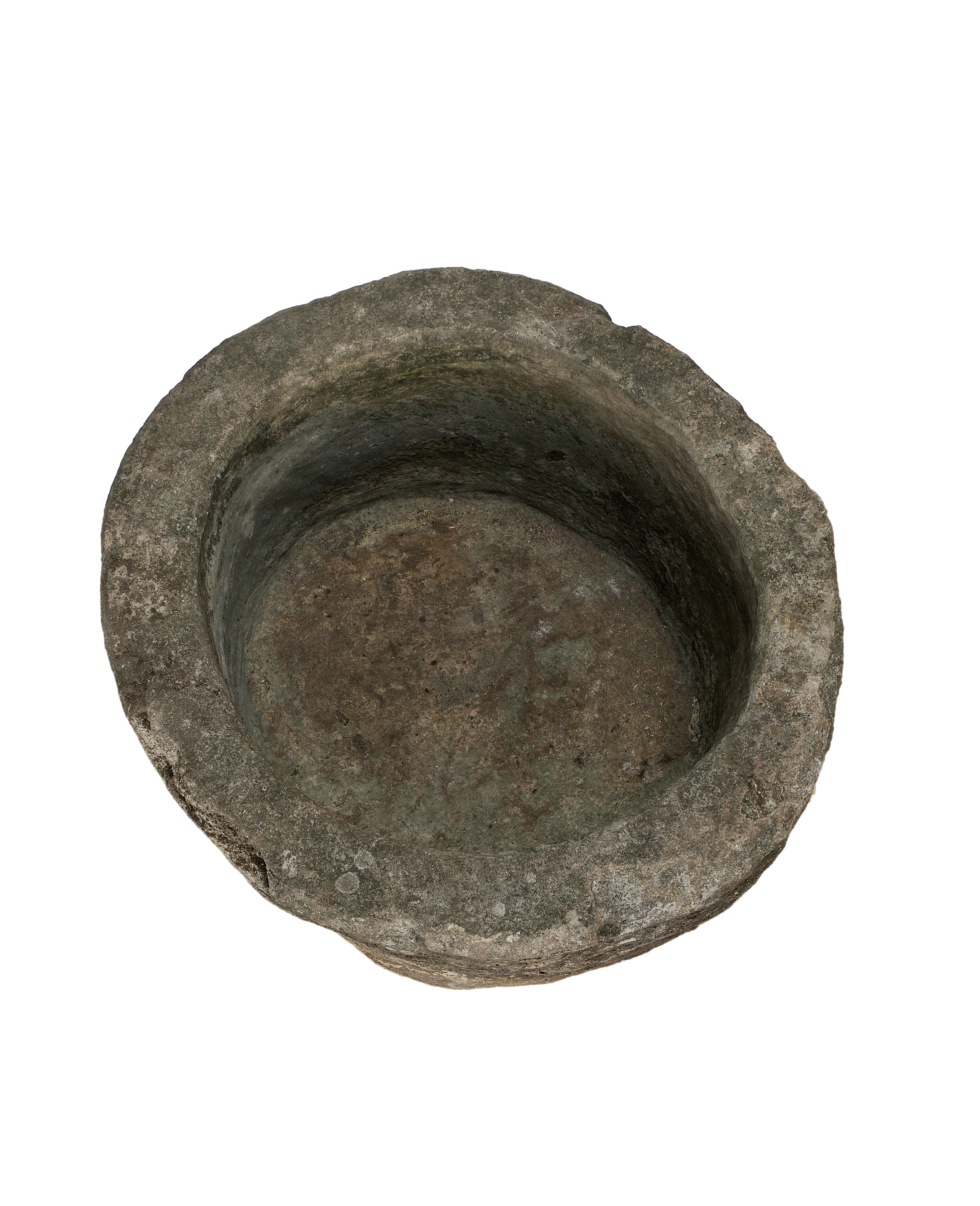 Vintage Indonesian round limestone trough, showing weathered and textured interior.