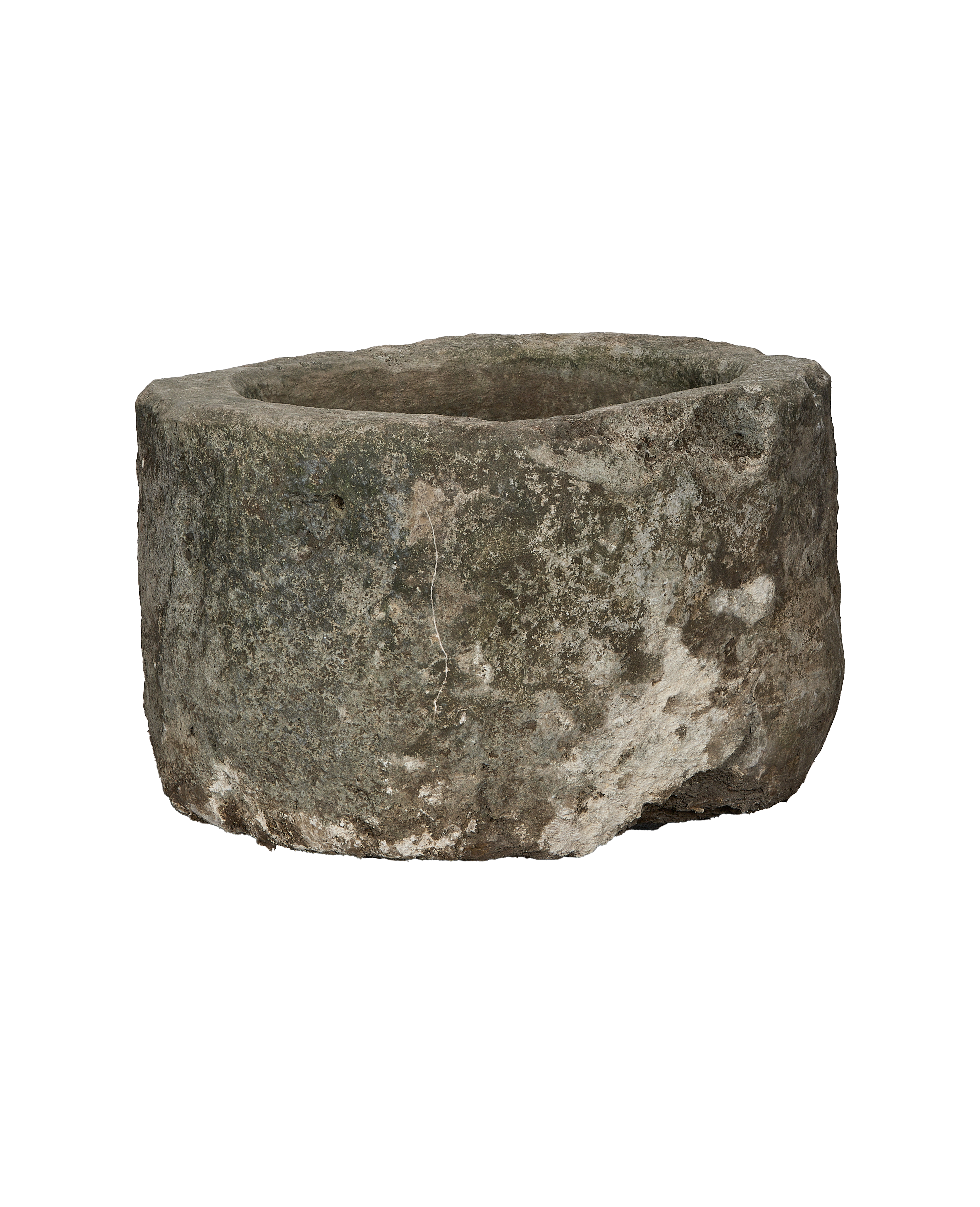 Vintage Indonesian limestone trough (OAK), slightly angled showing weathered surface and natural cracks.