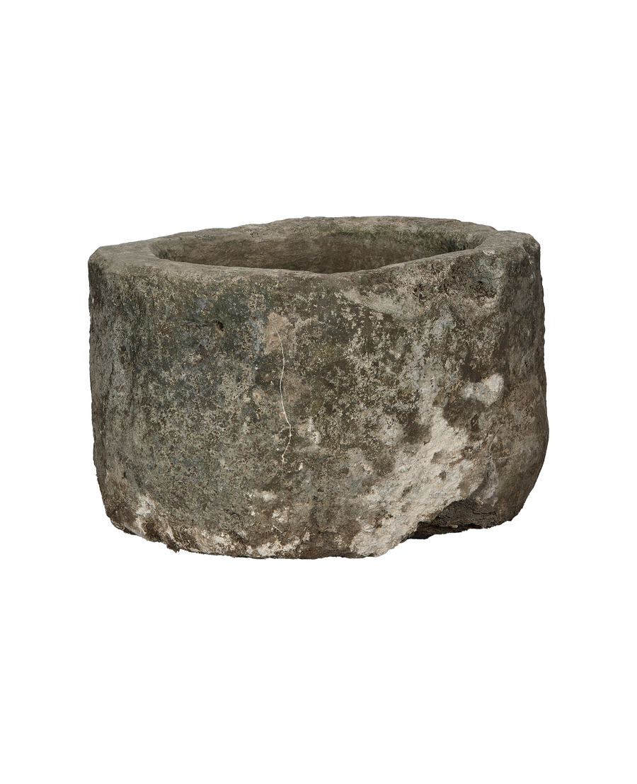Vintage Indonesian limestone trough (OAK), slightly angled showing weathered surface and natural cracks.
