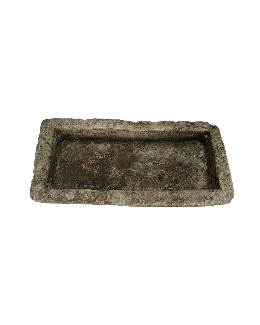 Vintage rectangular limestone trough, top view down showing weathered, textured interior.