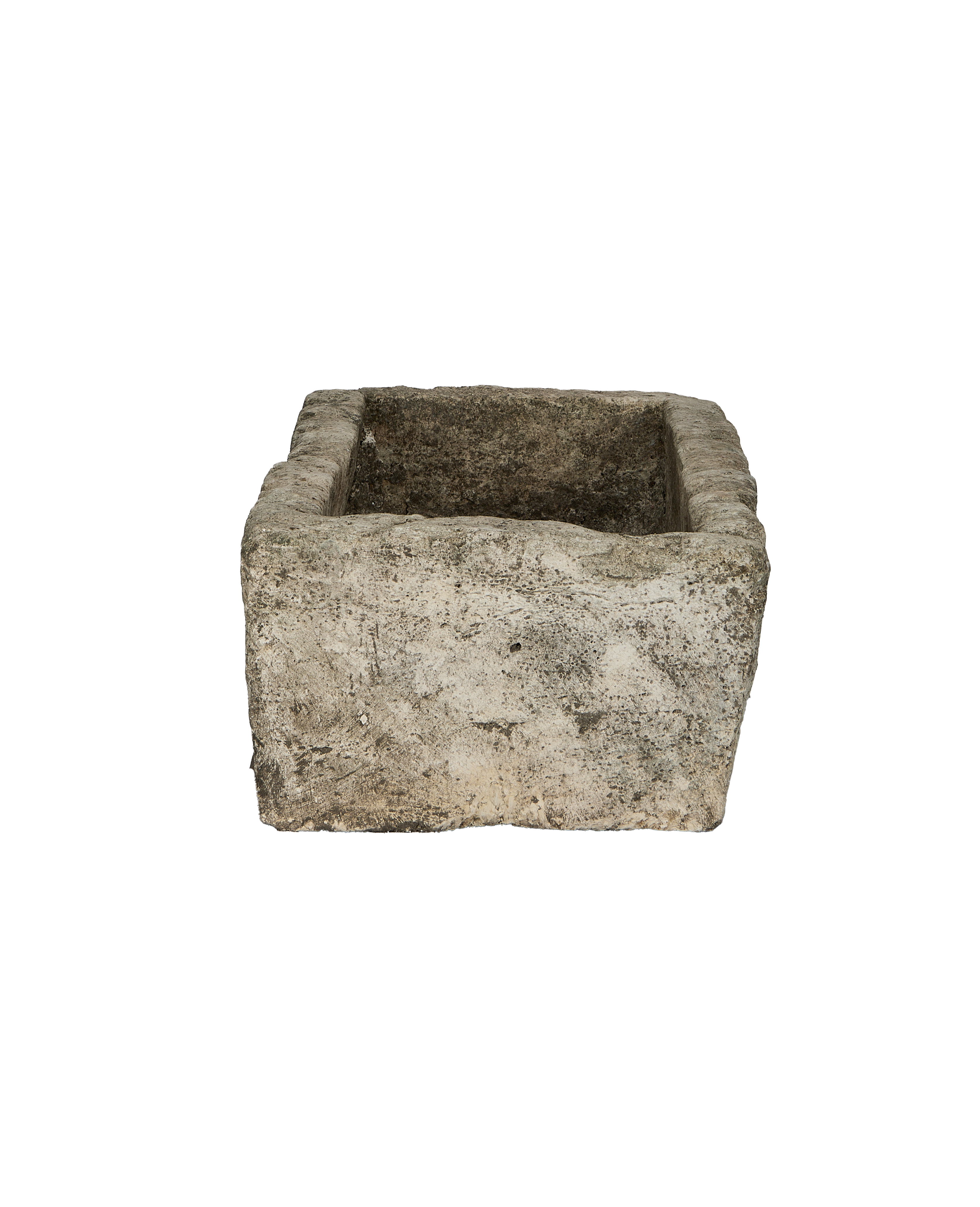 Vintage Indonesian limestone trough, top-down view showing rectangular opening, rough texture.