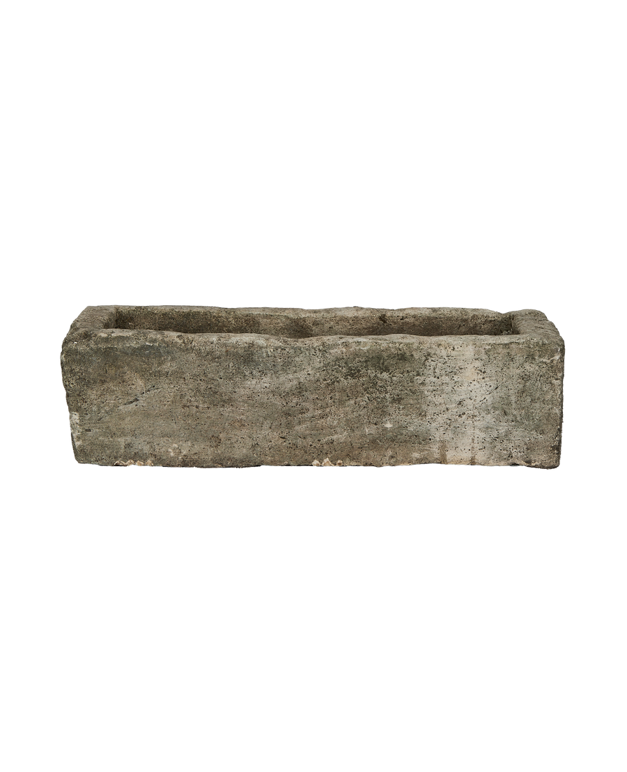 Vintage oblong limestone trough from Indonesia, showcasing weathered texture and aged patination.