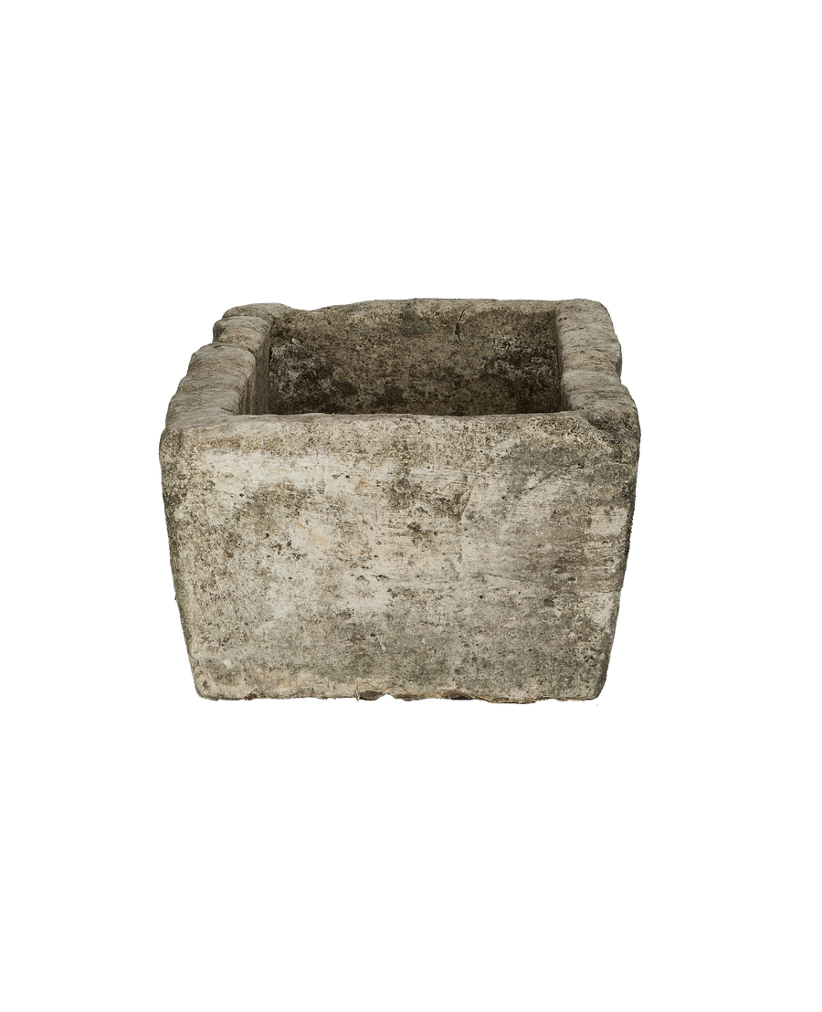 Vintage Indonesian rectangular limestone trough, front view of weathered, textured surface.