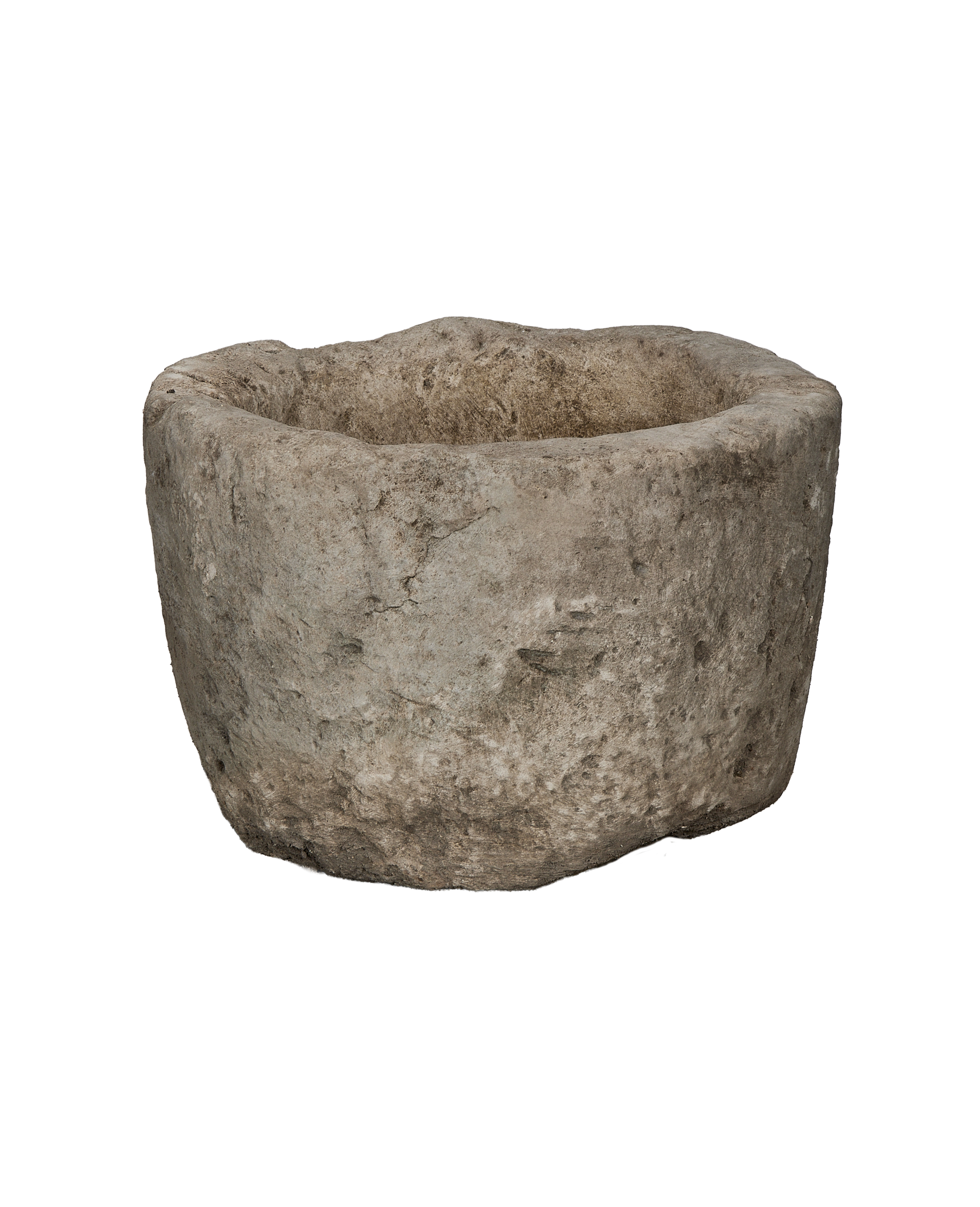 Vintage Indonesian round limestone trough, showing its rough, weathered exterior texture.