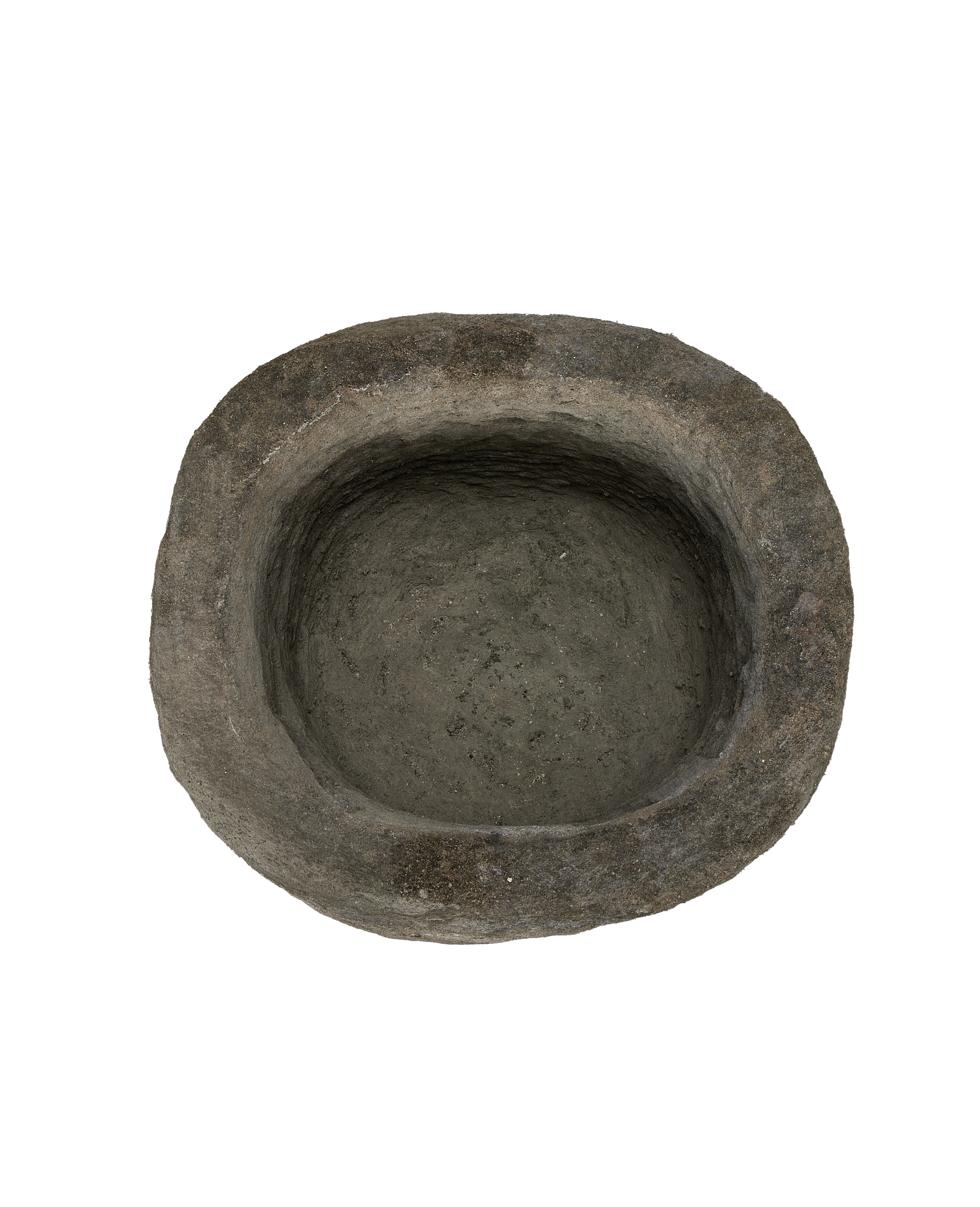 Vintage Indonesian limestone round trough from above, showcasing rough texture indoors.