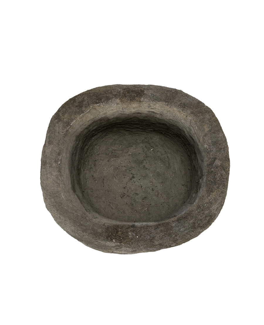 Vintage Indonesian limestone round trough from above, showcasing rough texture indoors.