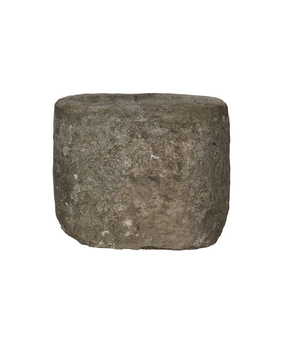Round Indonesian vintage limestone trough, close-up texture detail and weathered patina.