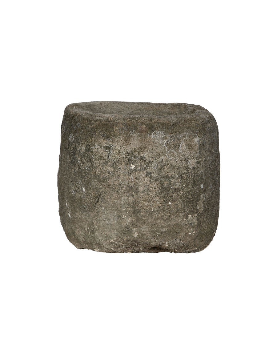 Vintage Indonesian limestone trough, round, showing detailed side texture and upper rim.