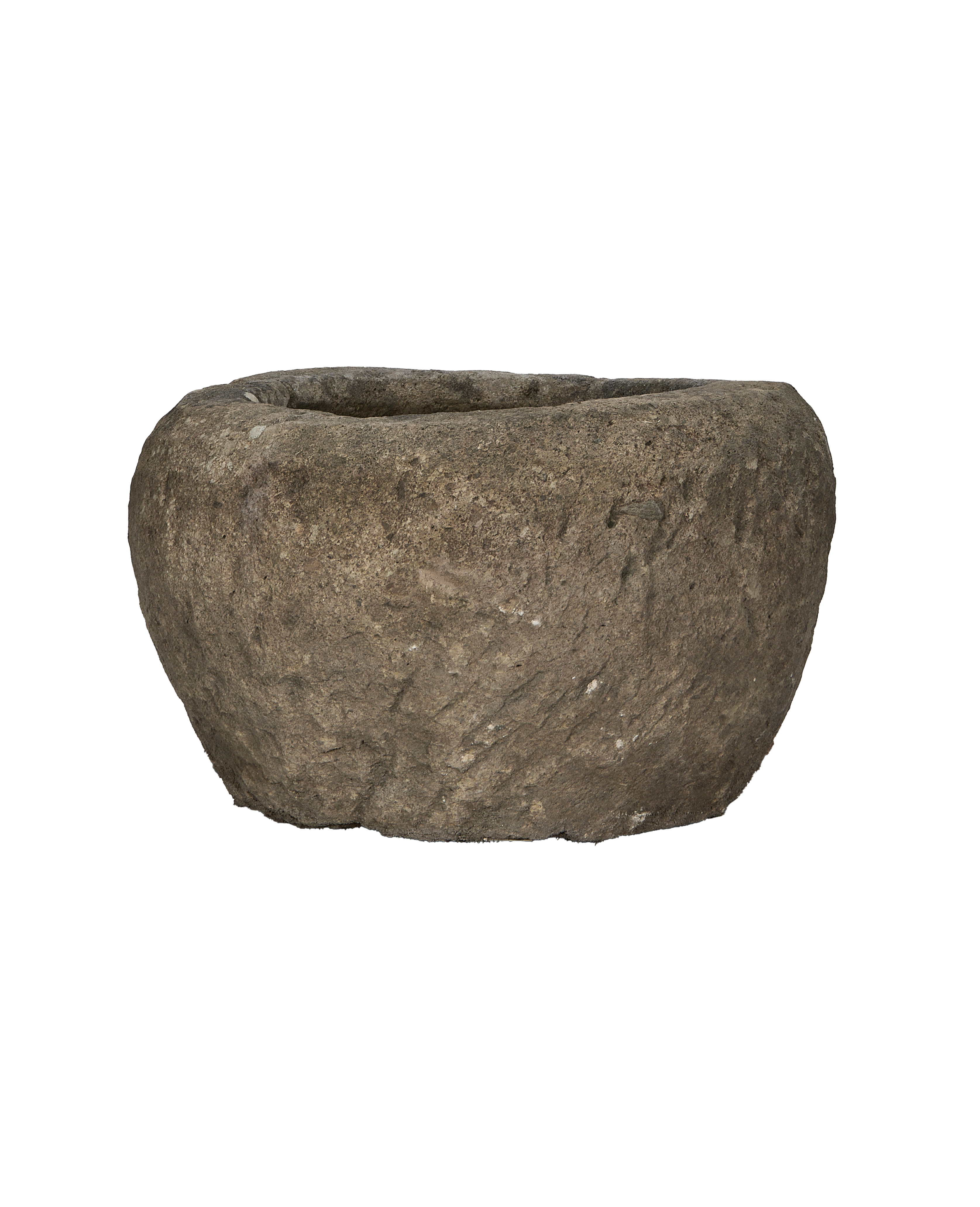 Vintage Indonesian limestone trough, displaying rugged texture and aged patina, side view.