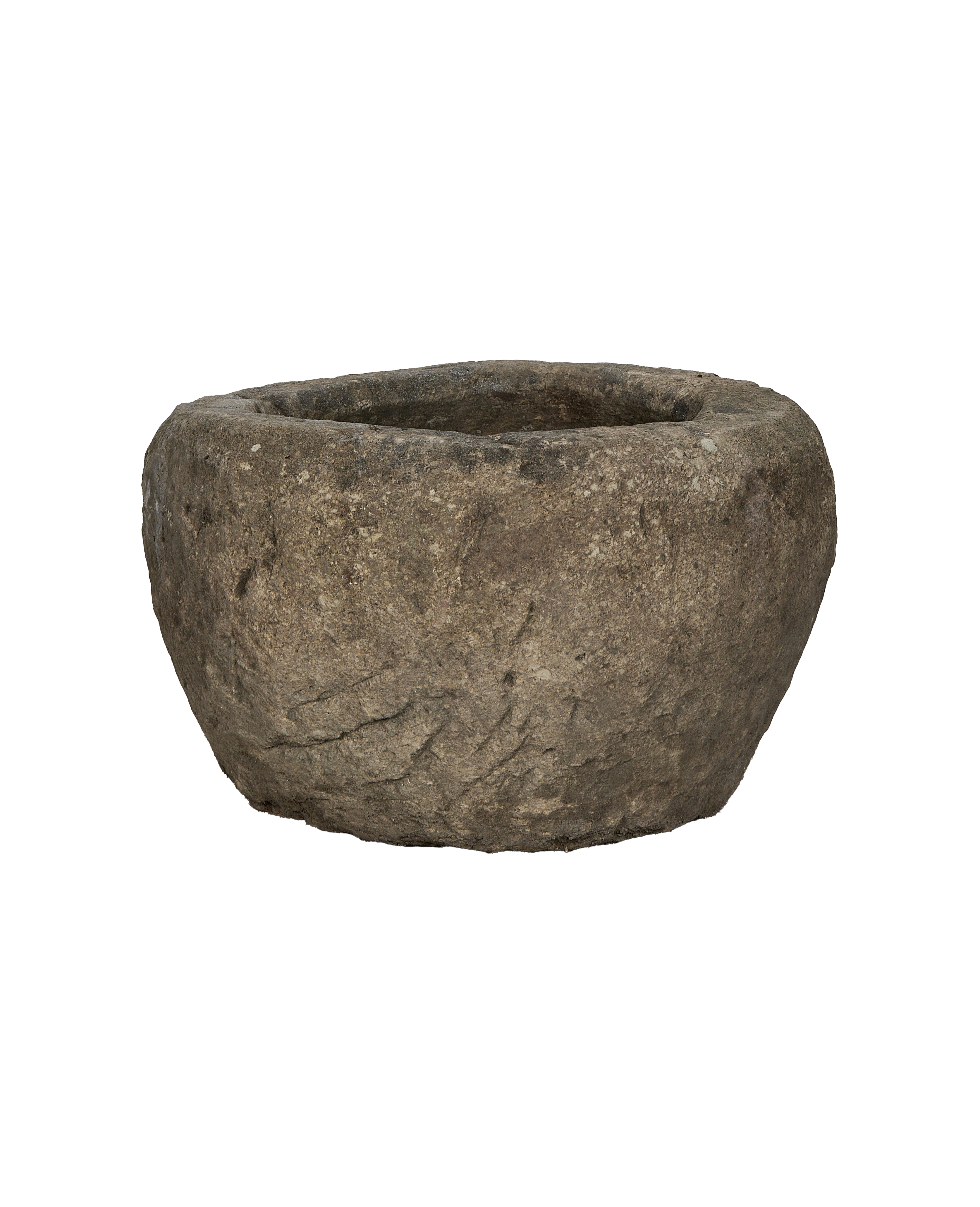Vintage round Indonesian limestone trough, showing textured side and weathered, aged condition.