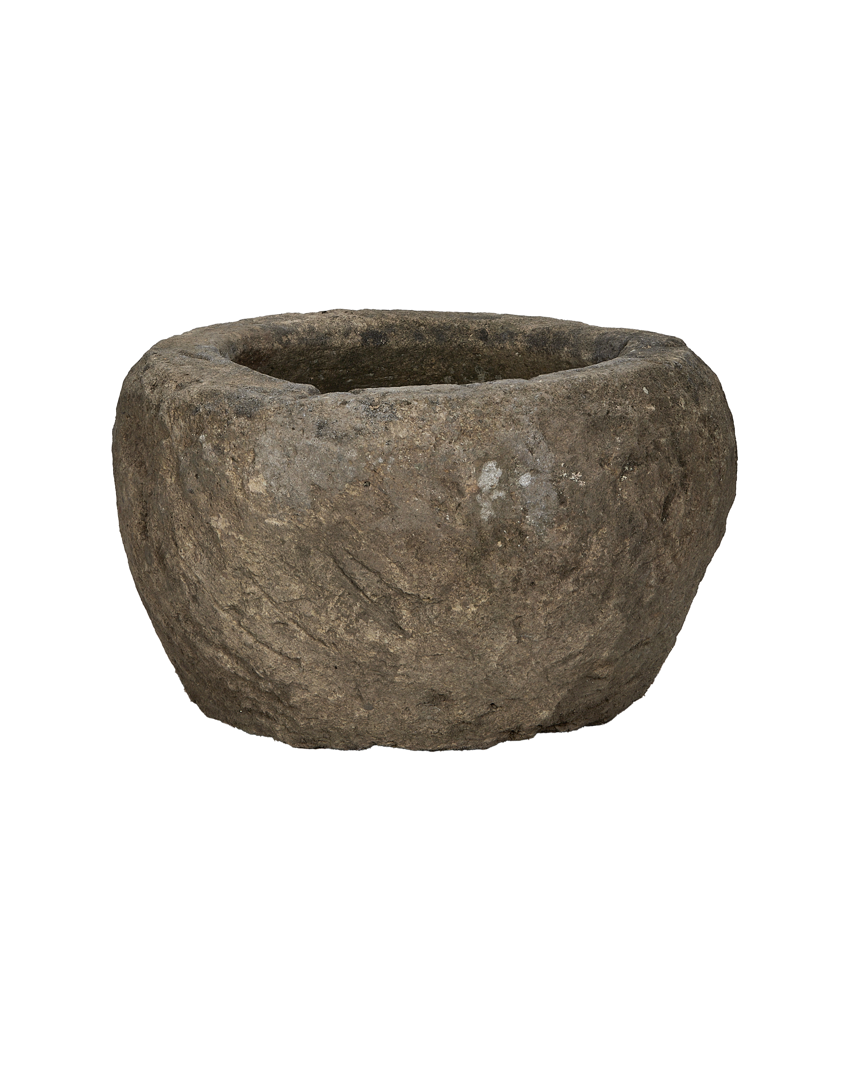 Vintage Indonesian round limestone trough, side profile, revealing natural rough texture and weathered finish.