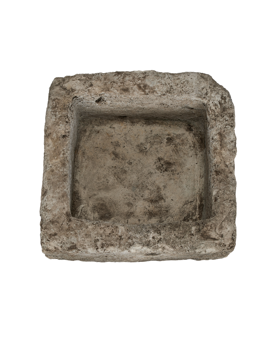 Vintage Indonesian square limestone trough, top-down view showing interior texture and condition.