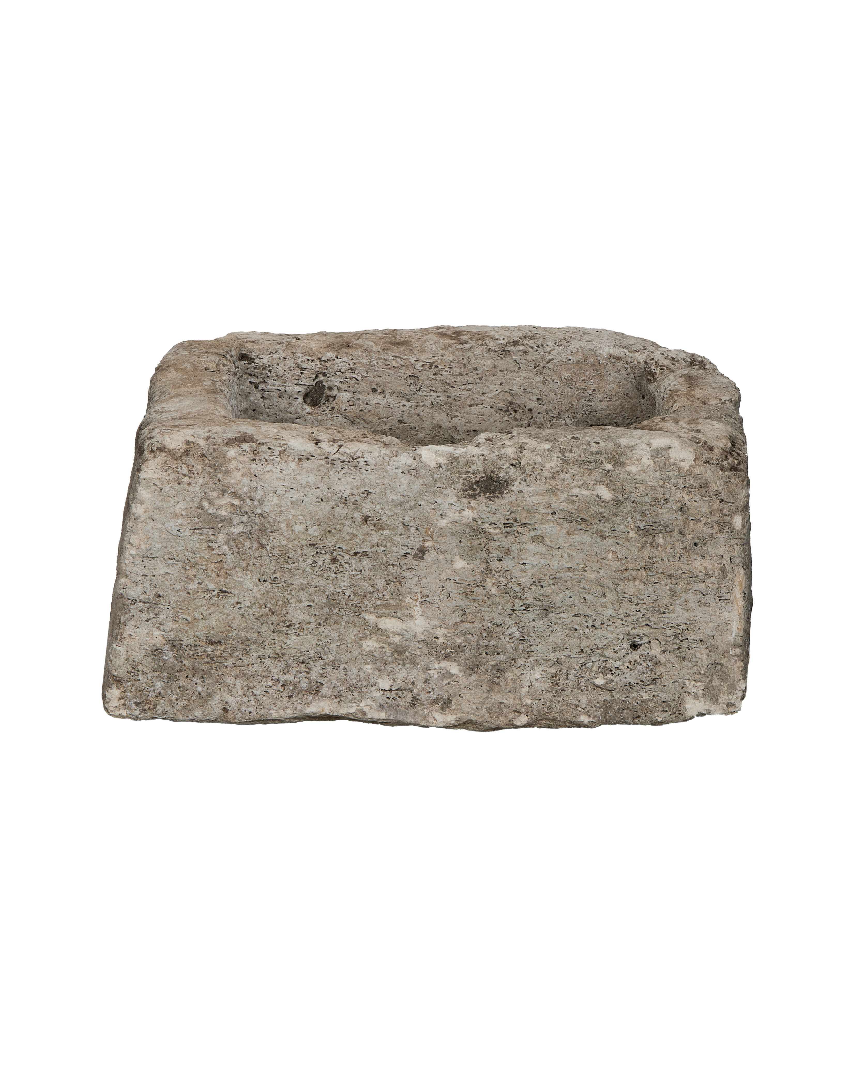 Vintage Indonesian limestone trough, square shape, showing rough weathered texture.
