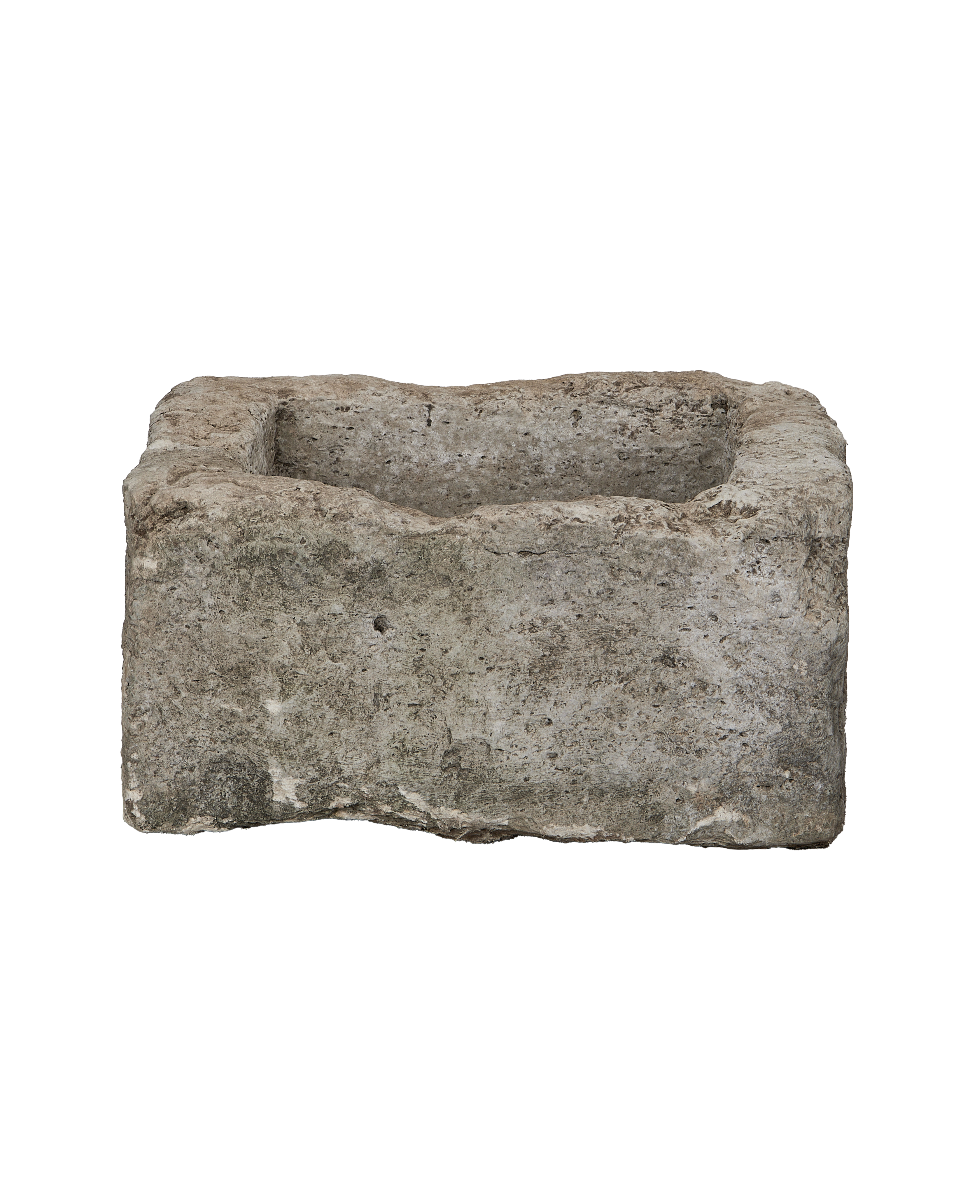 Square vintage Indonesian limestone trough, detailed texture of the weathered stone exterior.