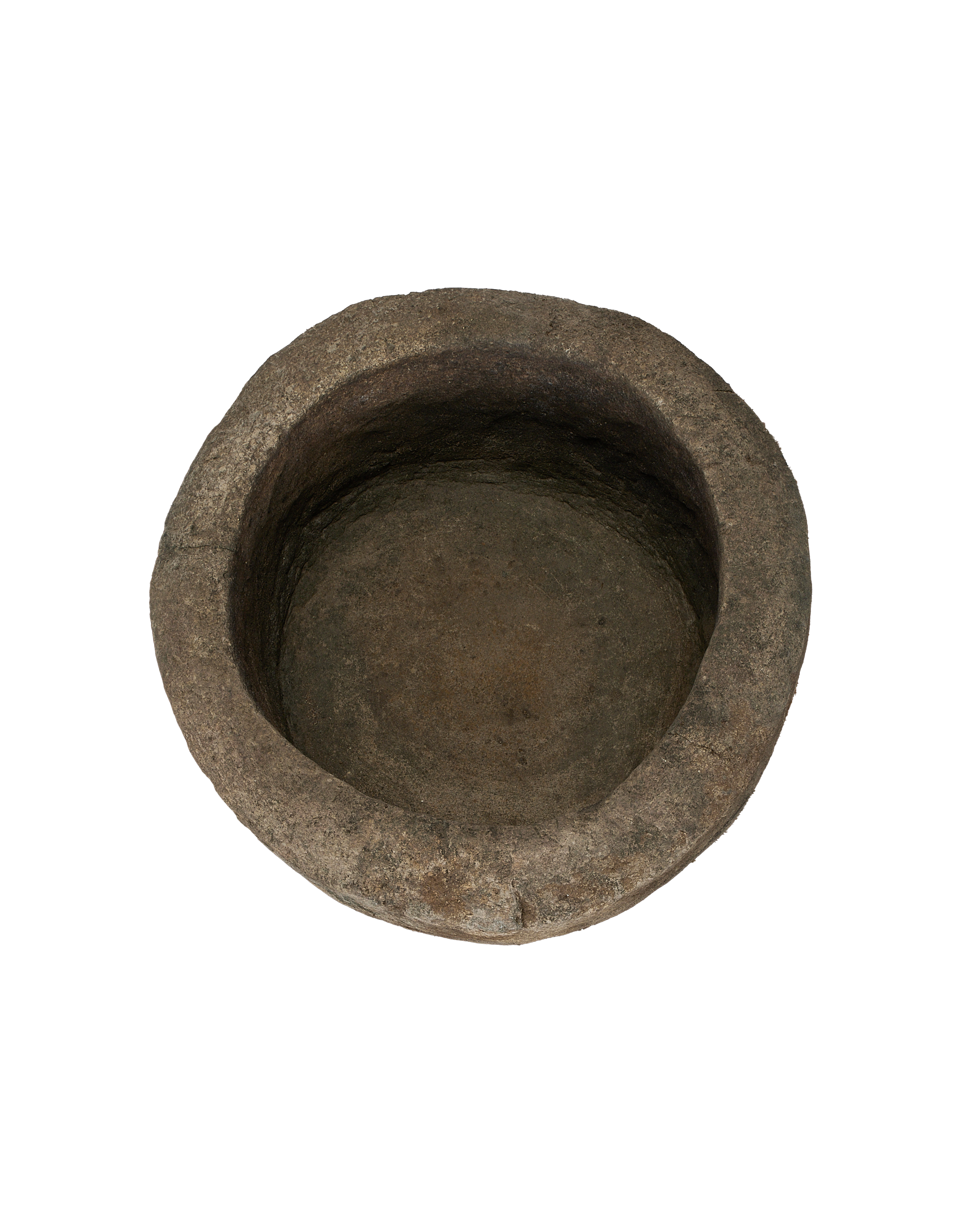 Vintage Indonesian round limestone trough, visible textured interior and rough-hewn rim.