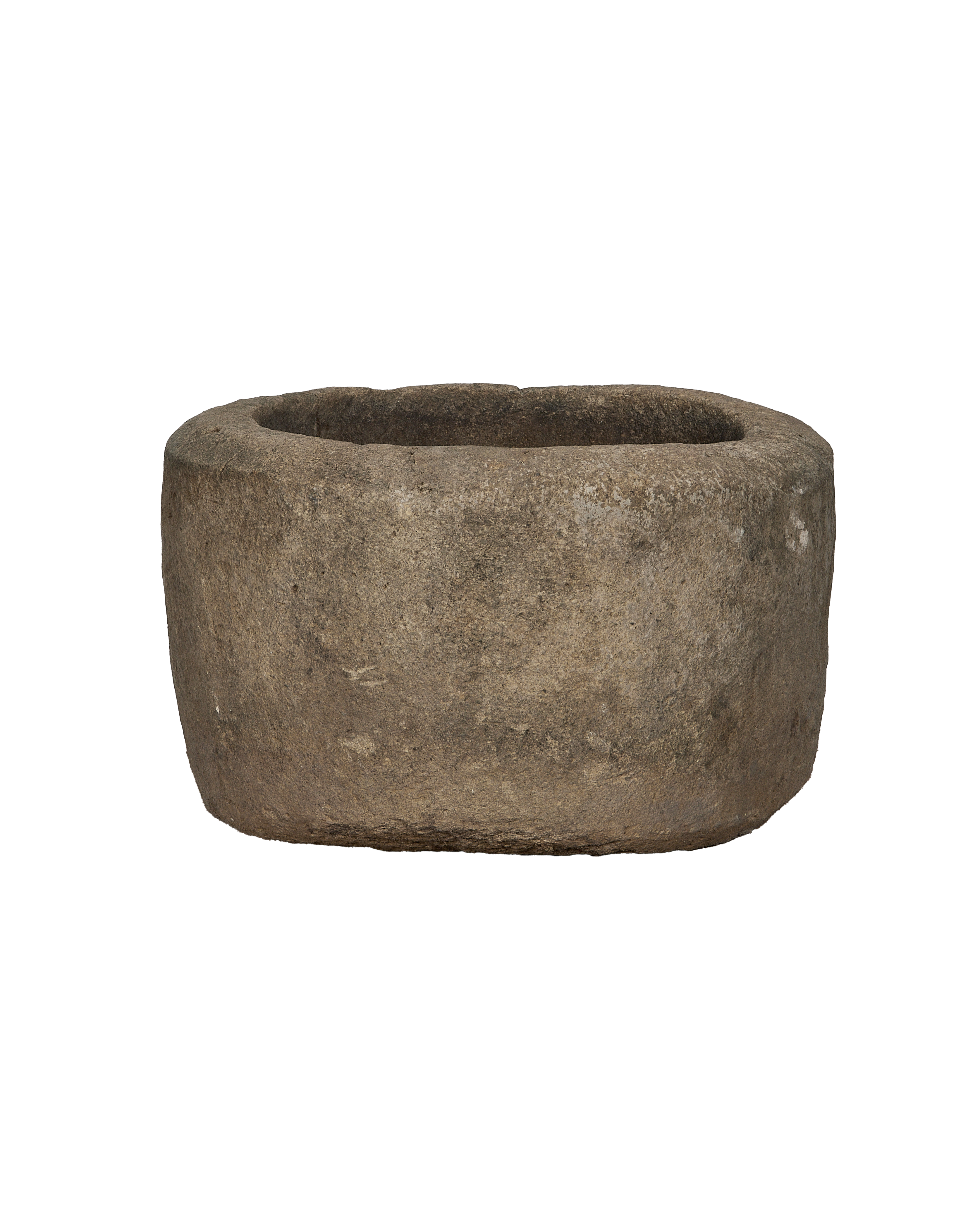 Vintage Indonesian round limestone trough, showing rough textured exterior and aged patina.