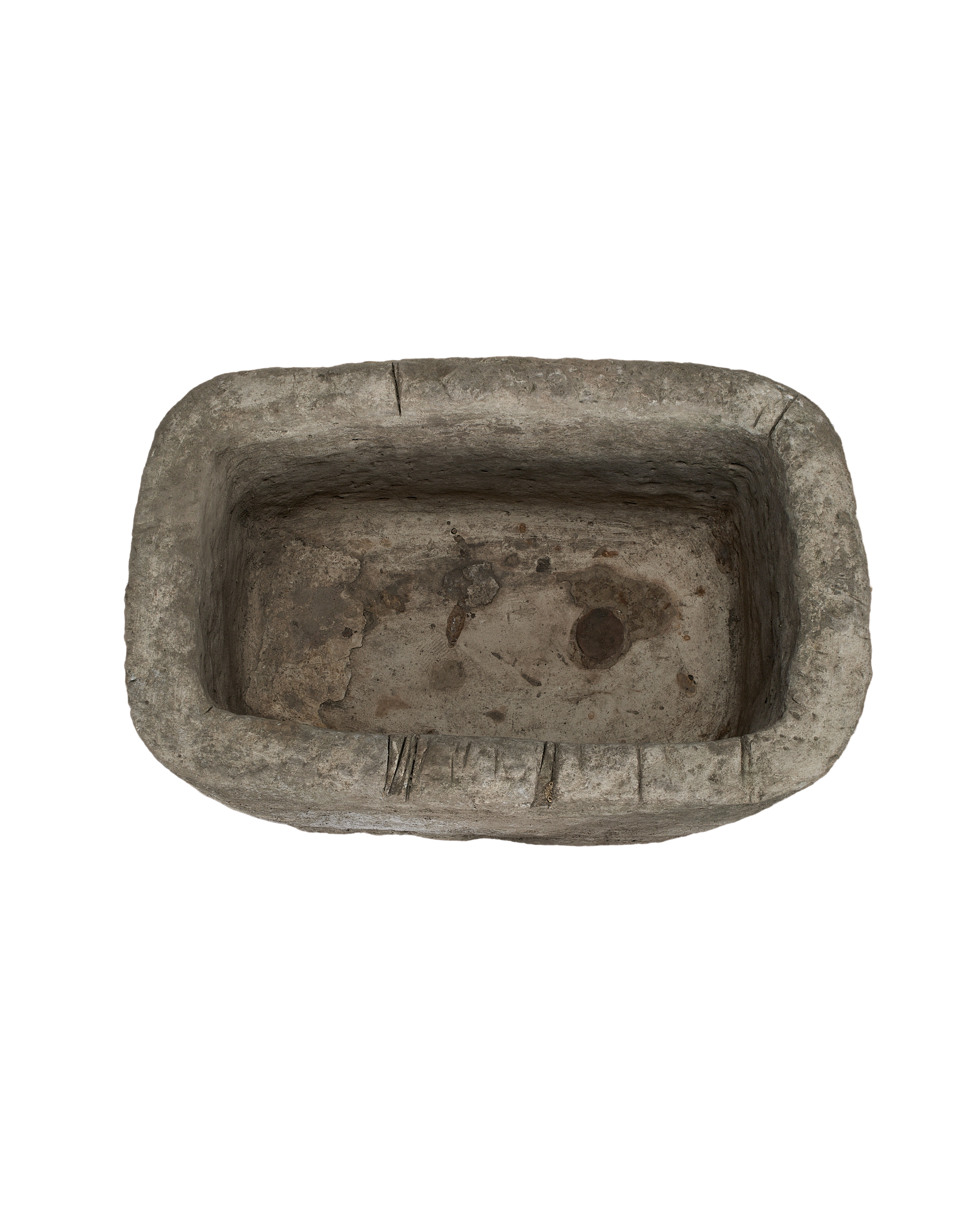 Vintage Indonesian rectangular limestone trough, showing distressed interior with earthy patinas and drain holes.