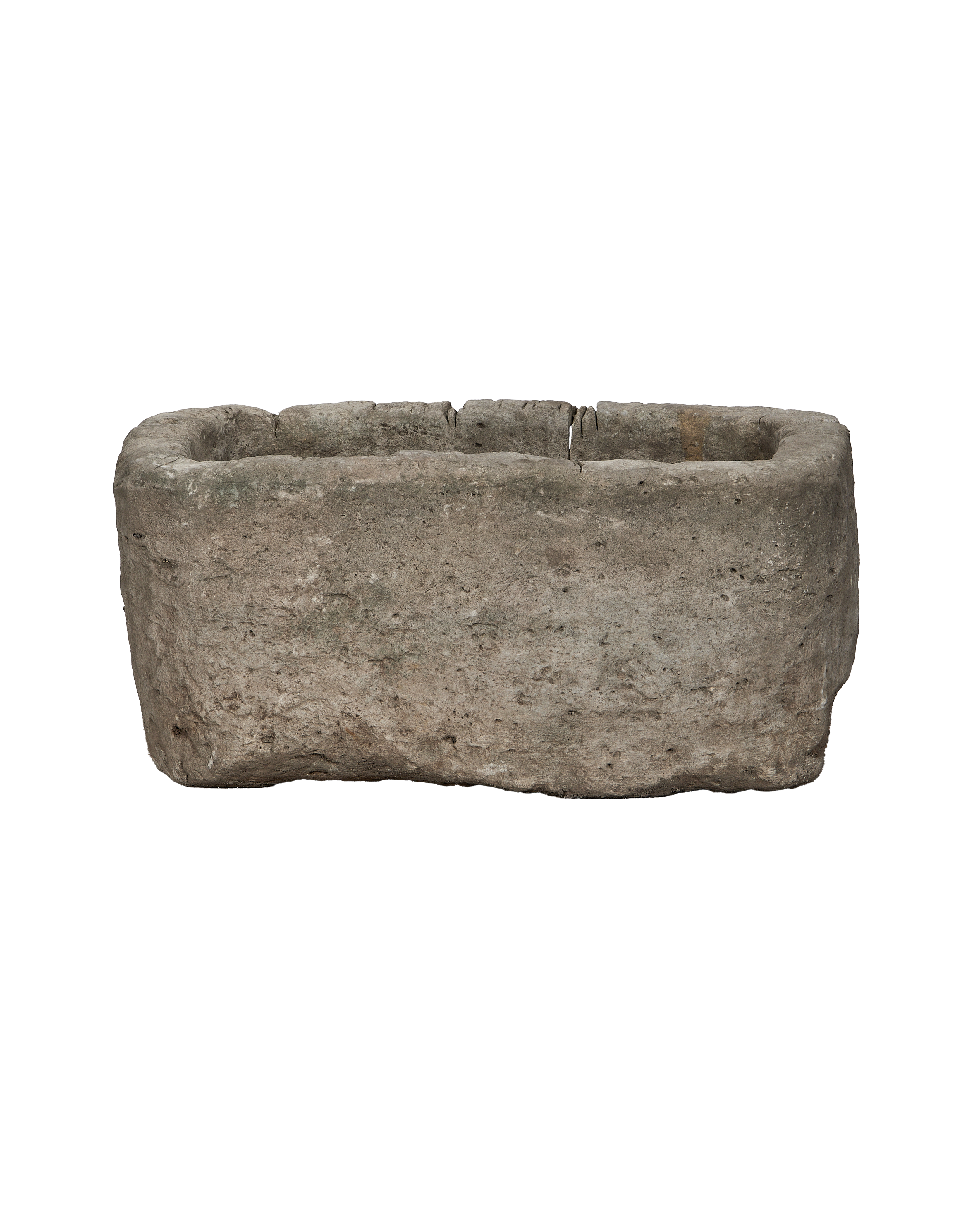 Vintage Indonesian limestone trough, rectangular, rough textured surface with chipped edges, showing its weathered condition.