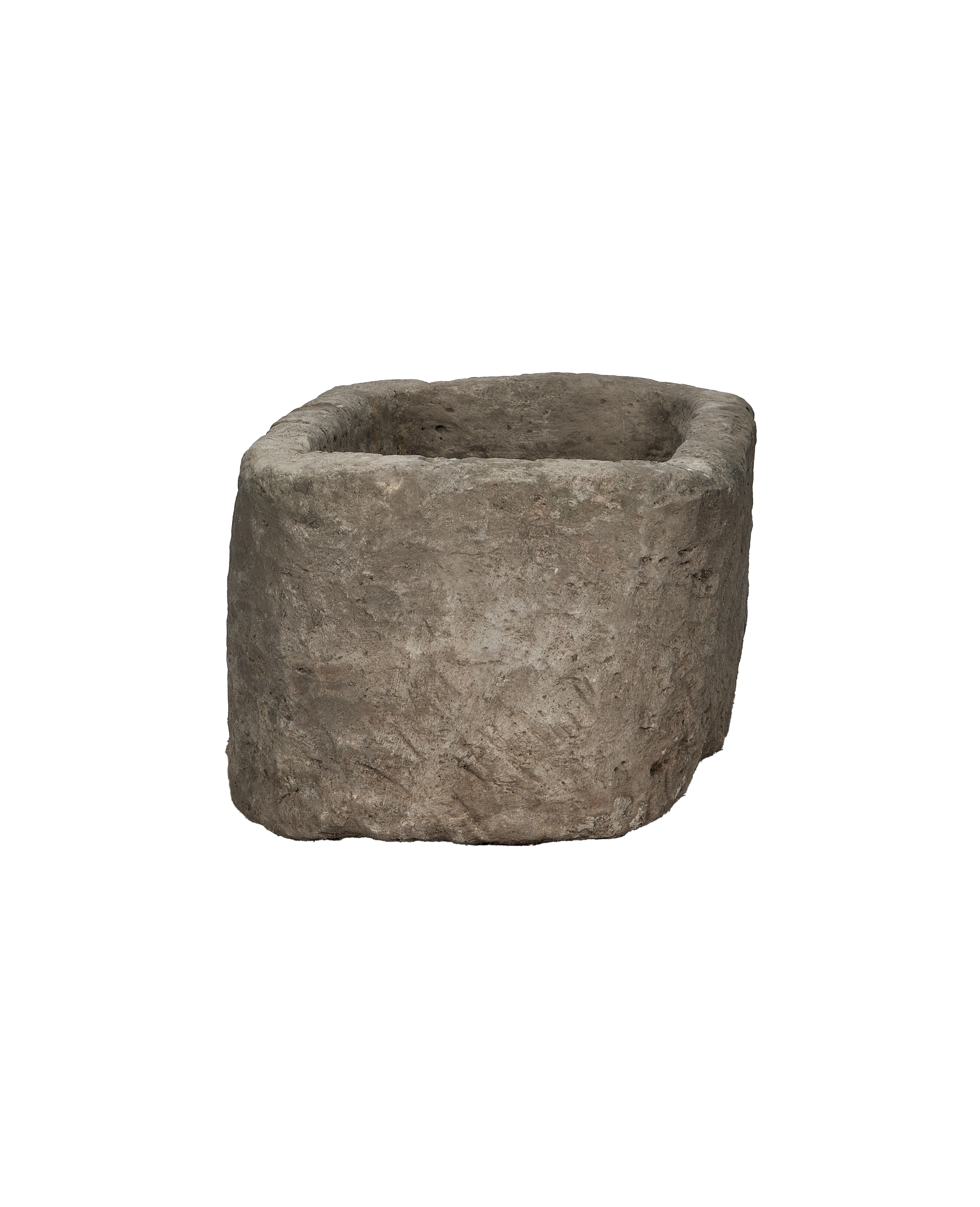 Vintage Indonesian limestone trough, oak, showing rough, textured exterior surface and uneven rim.