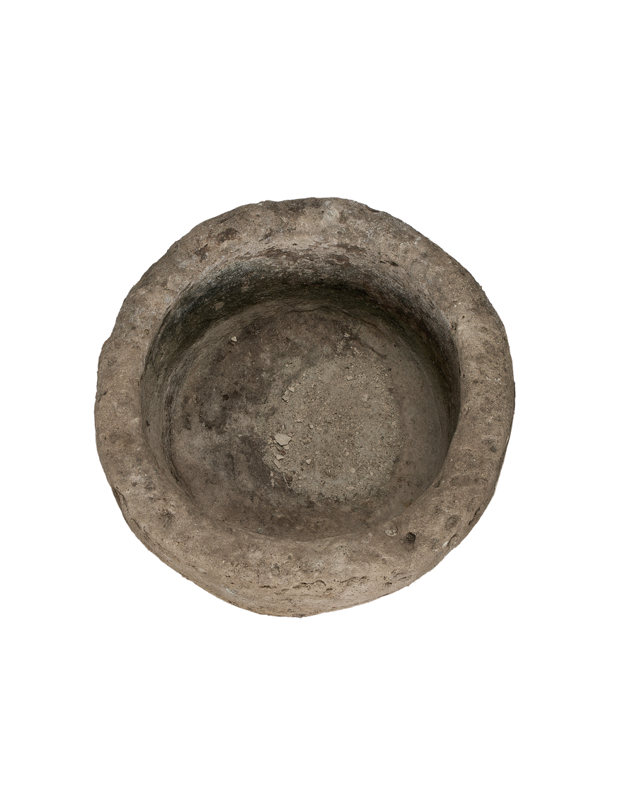 Vintage Indonesian round limestone trough, top-down view showing interior texture and depth.