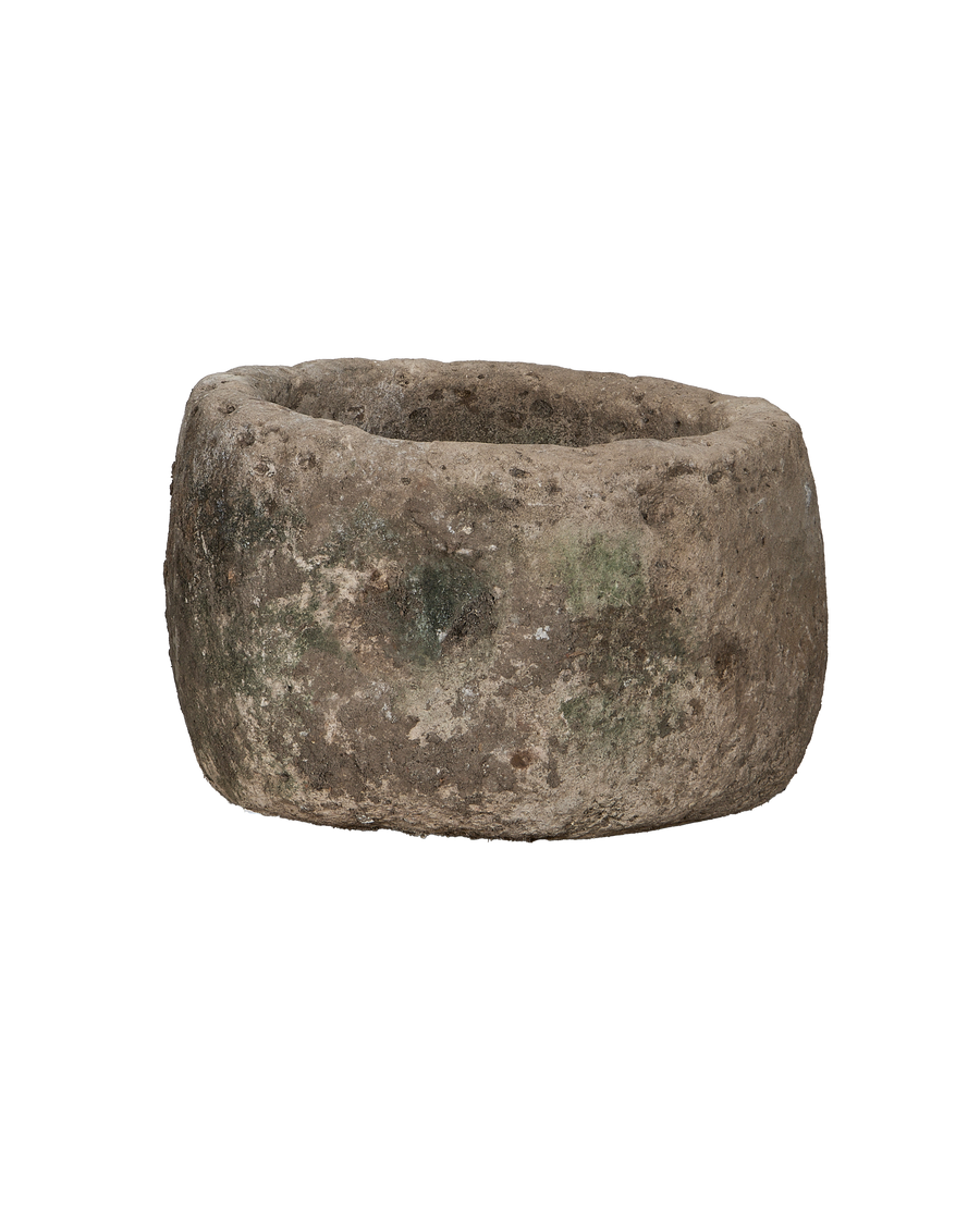 Vintage round Indonesian limestone trough, detailed weathered texture and inner basin.