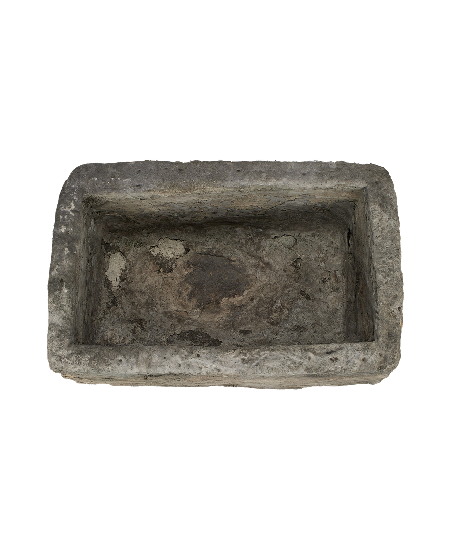 Vintage Indonesian limestone trough, top view, showing aged, textured interior.