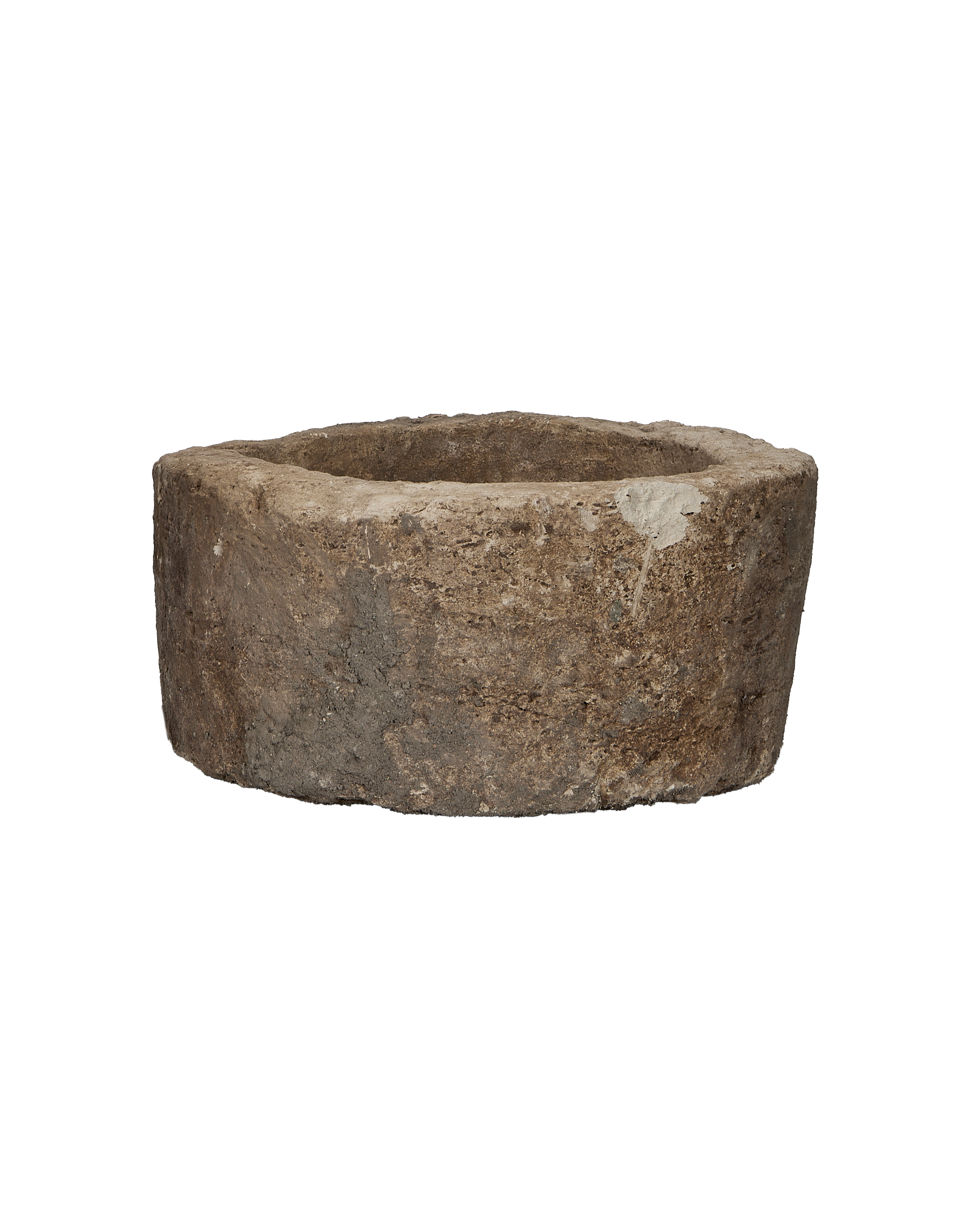 Vintage Indonesian round limestone trough, showing its aged, weathered surface and organic texture.