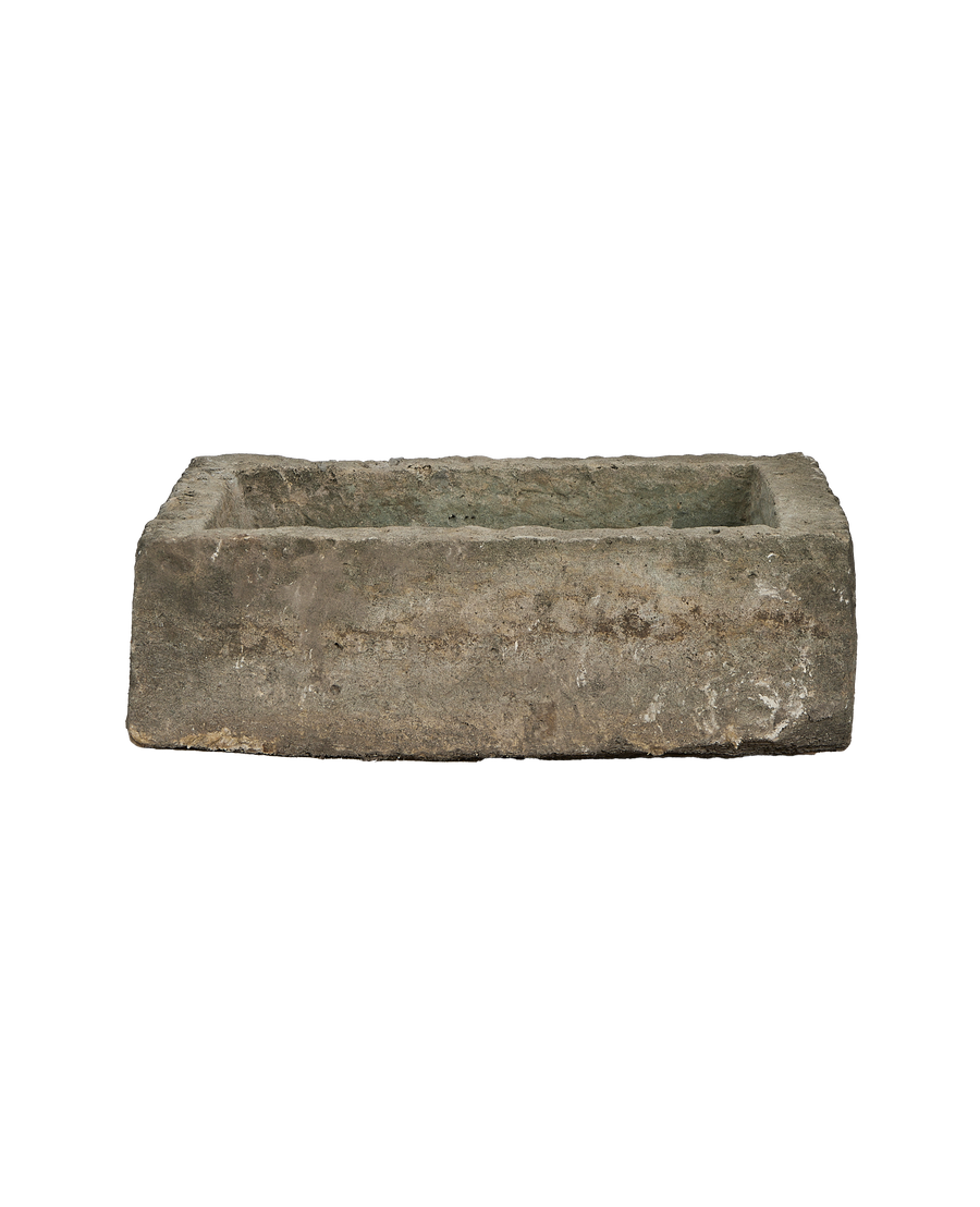 Vintage rectangular Indonesian limestone trough, showing weathered texture and interior basin from above.