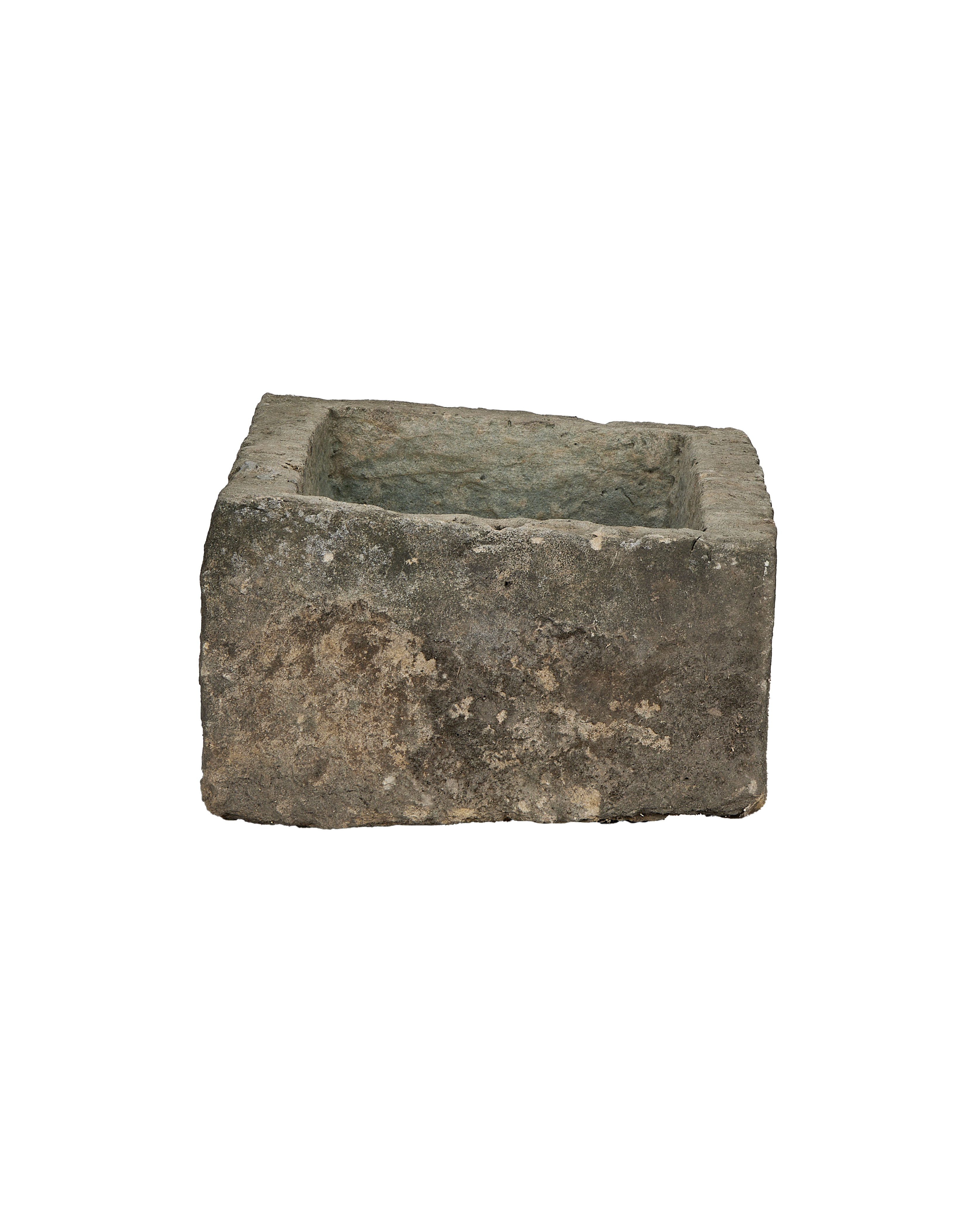 Vintage Indonesian limestone trough, top-down view showing weathered rectangular basin with rough texture.