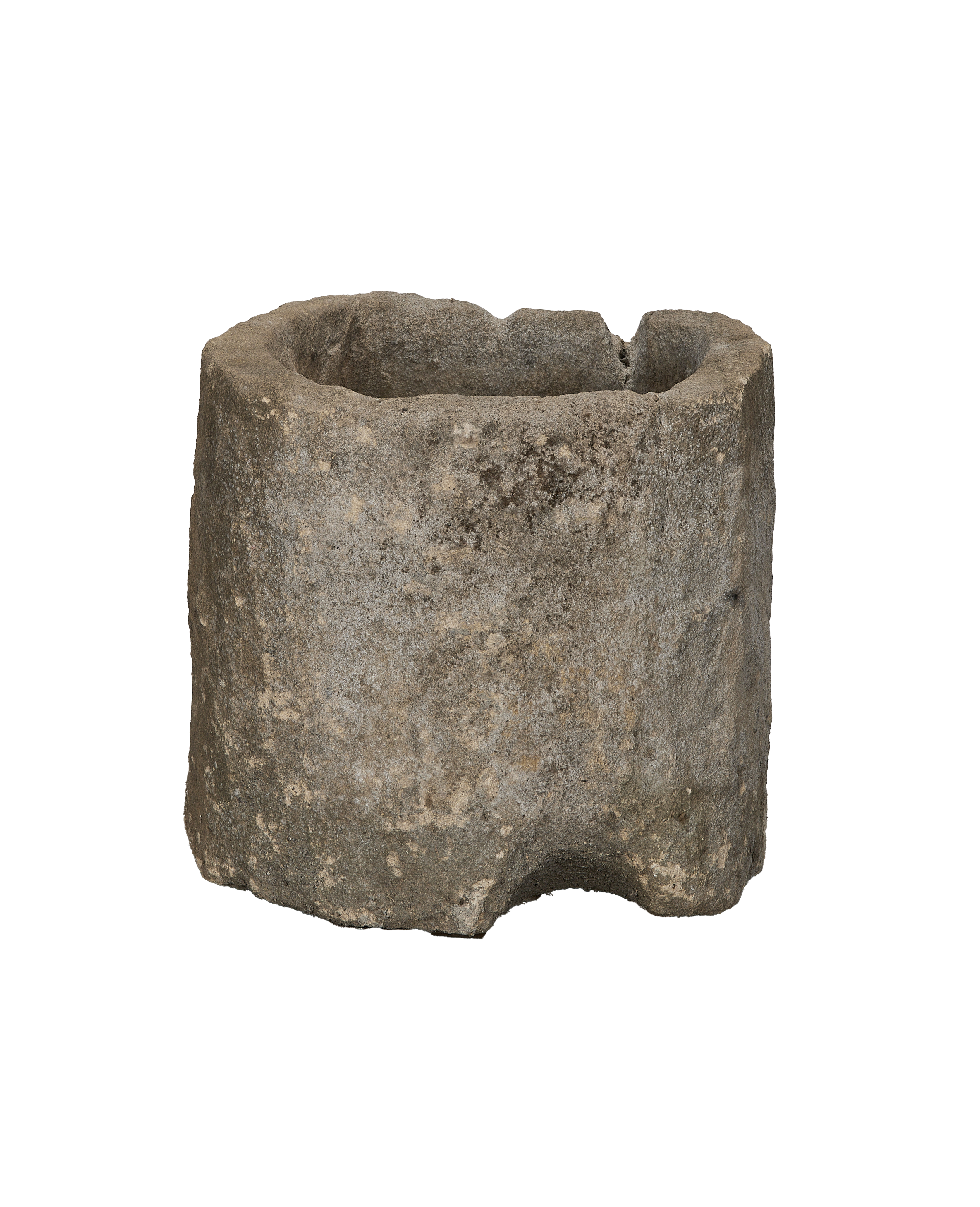 Vintage Indonesian limestone trough, showing a full, weathered cylindrical body with an oblong opening.