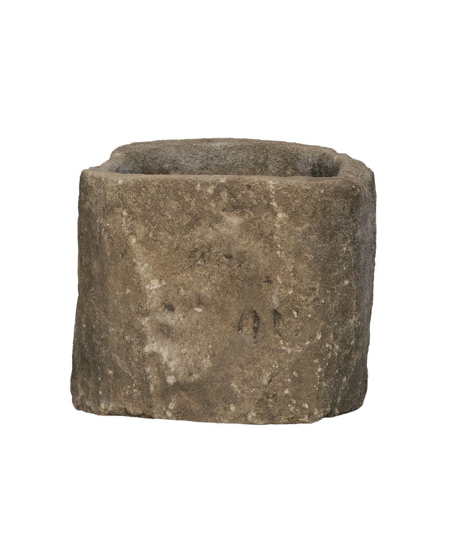 Vintage Indonesian oblong limestone trough, showing the rough, textured surface with weathered details.