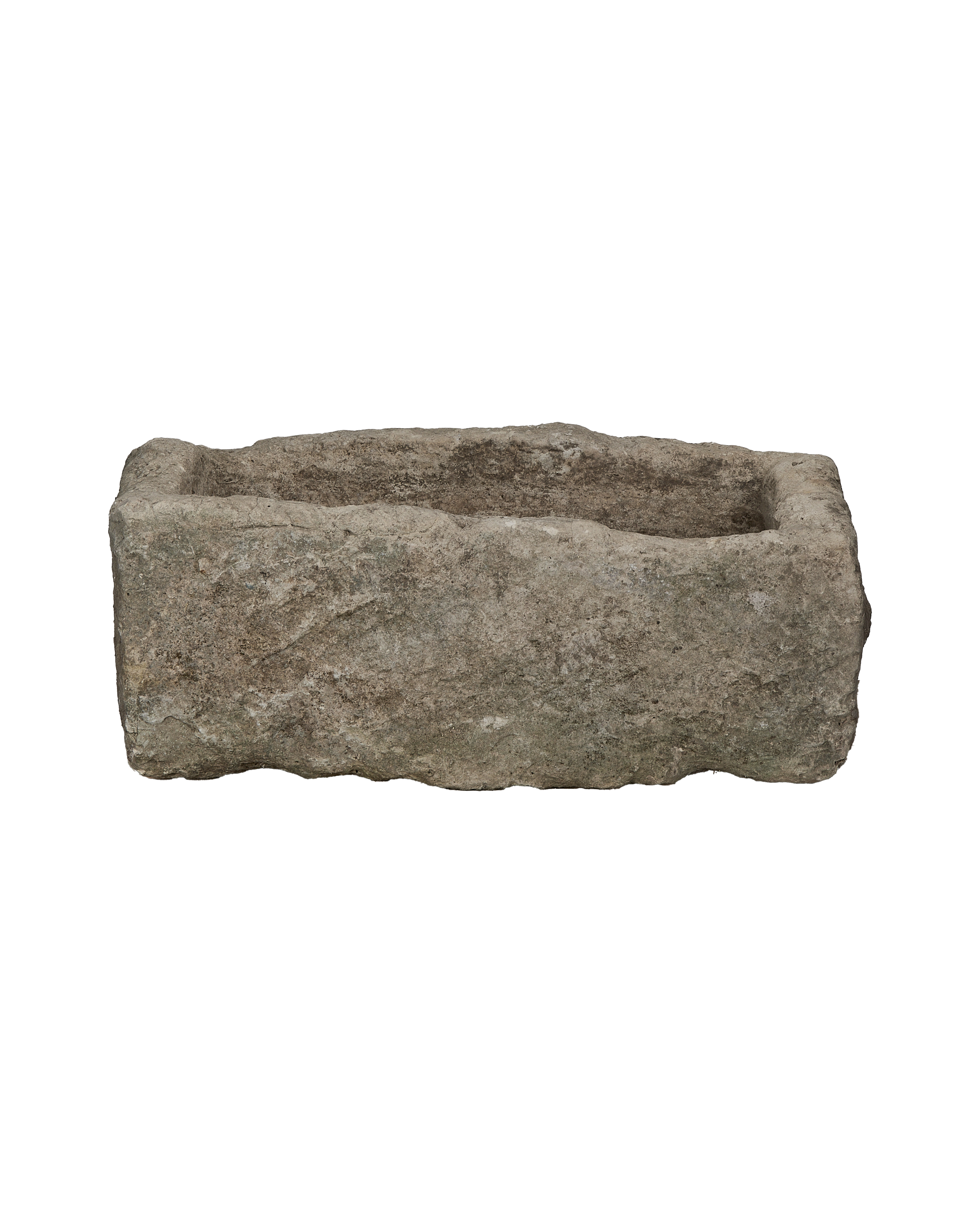 Vintage rectangular limestone trough, weathered gray, showing rugged exterior texture against black background.