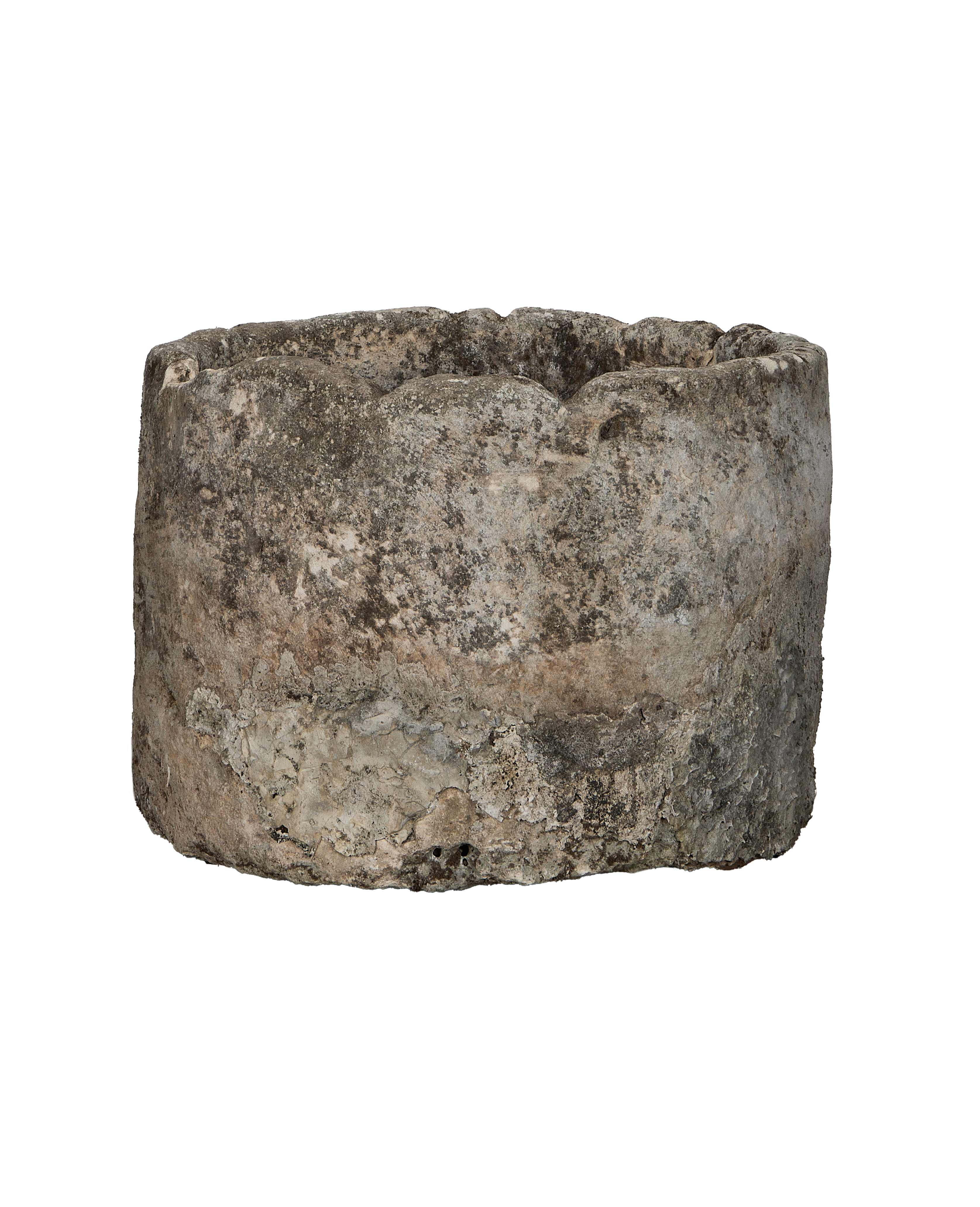 Vintage Indonesian round limestone trough, showing weathered side texture and rough rim detail.