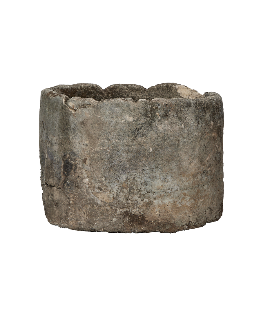 Vintage round limestone trough, Indonesia, showing rough texture, weathered patina, and organic rim detail.