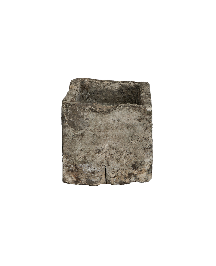 Vintage rectangular limestone trough, weathered gray, with a distinctive vertical fissure on its front face.