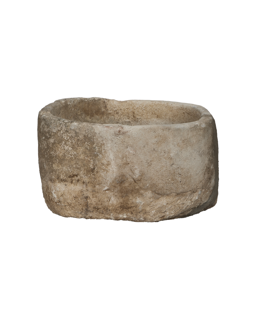 Vintage Indonesian limestone trough, round, showing detailed weathered texture and natural imperfections.