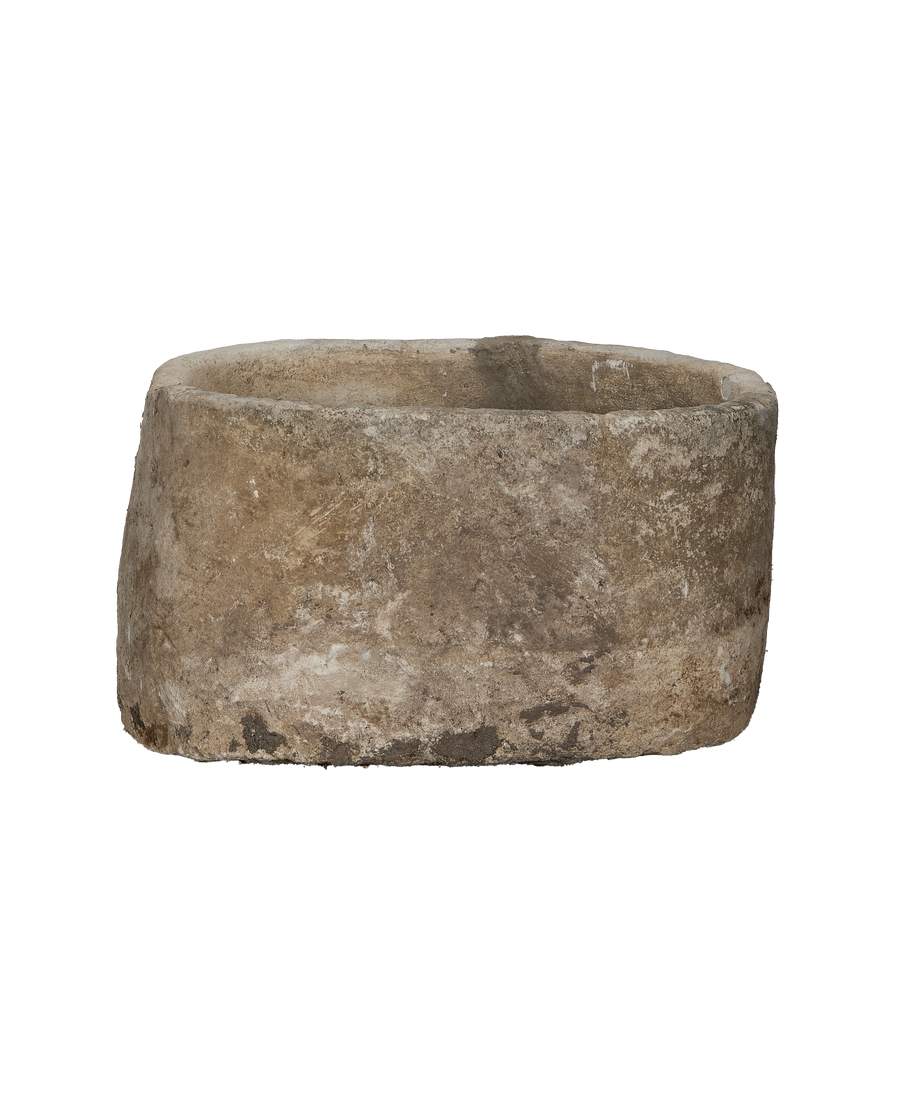 Vintage round limestone trough, showing weathered texture and earthy patina, from Indonesia.