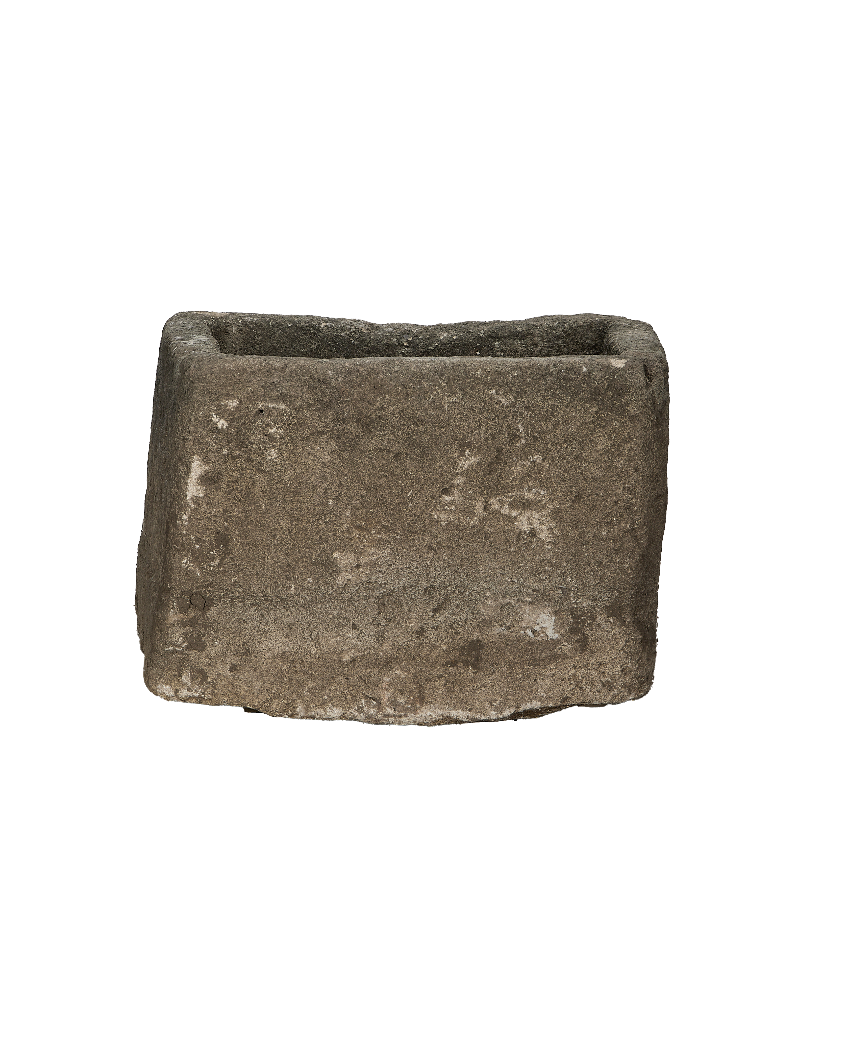 Vintage Indonesian square limestone trough, weathered surface texture close up from side.
