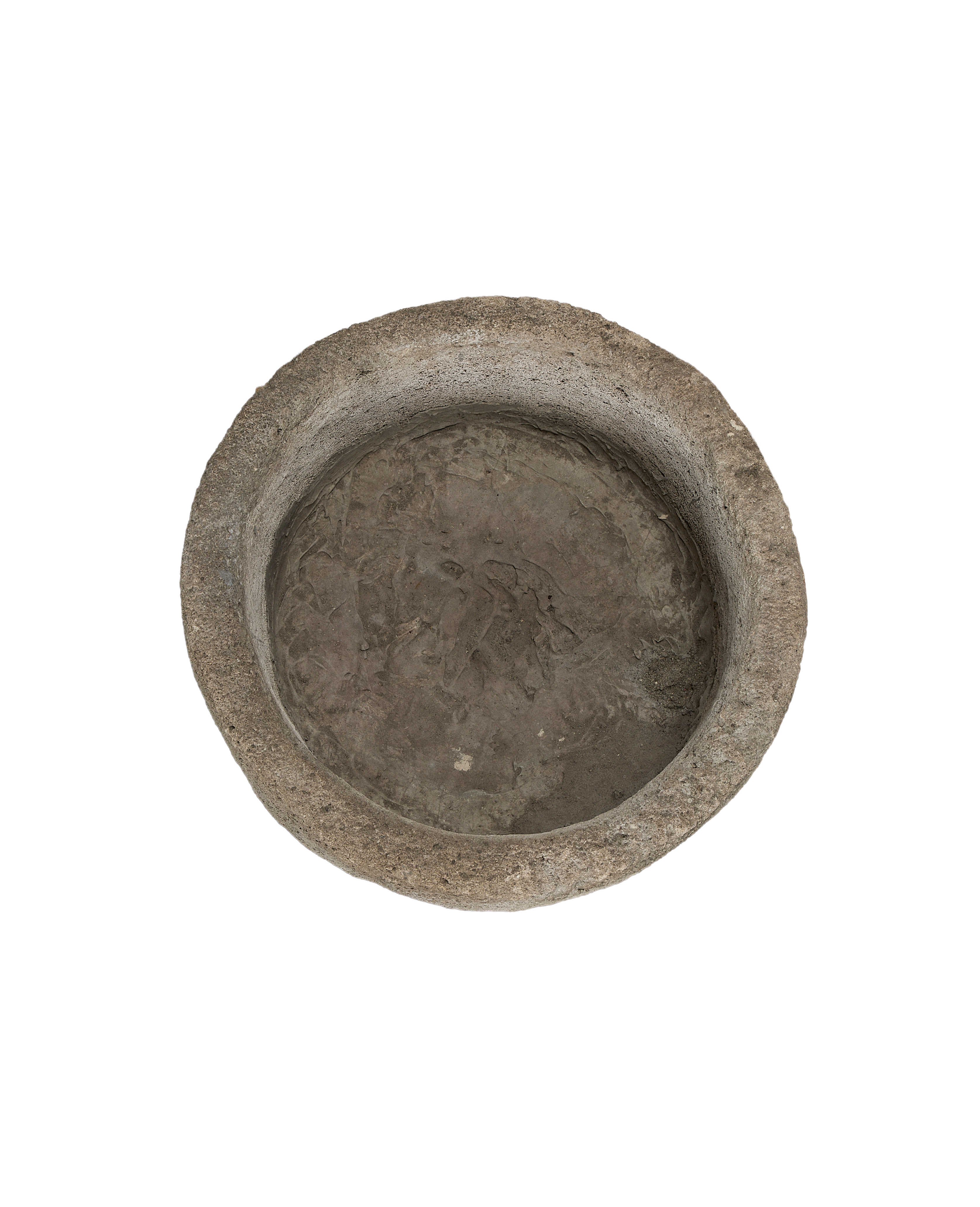 Vintage Indonesian round limestone trough, top-down view showing weathered interior texture.
