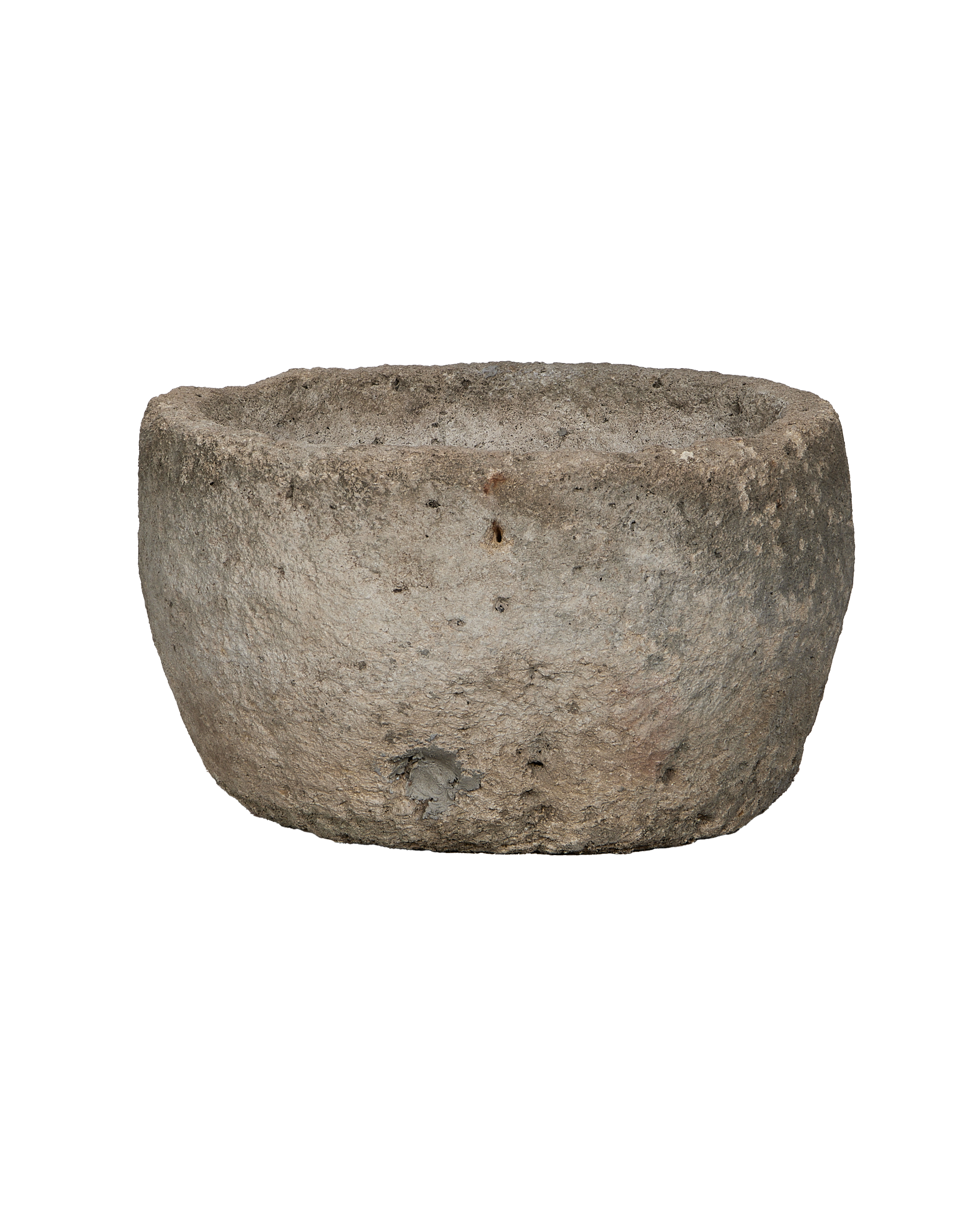 Vintage Indonesian round limestone trough, rich textured surface, showing age and character.