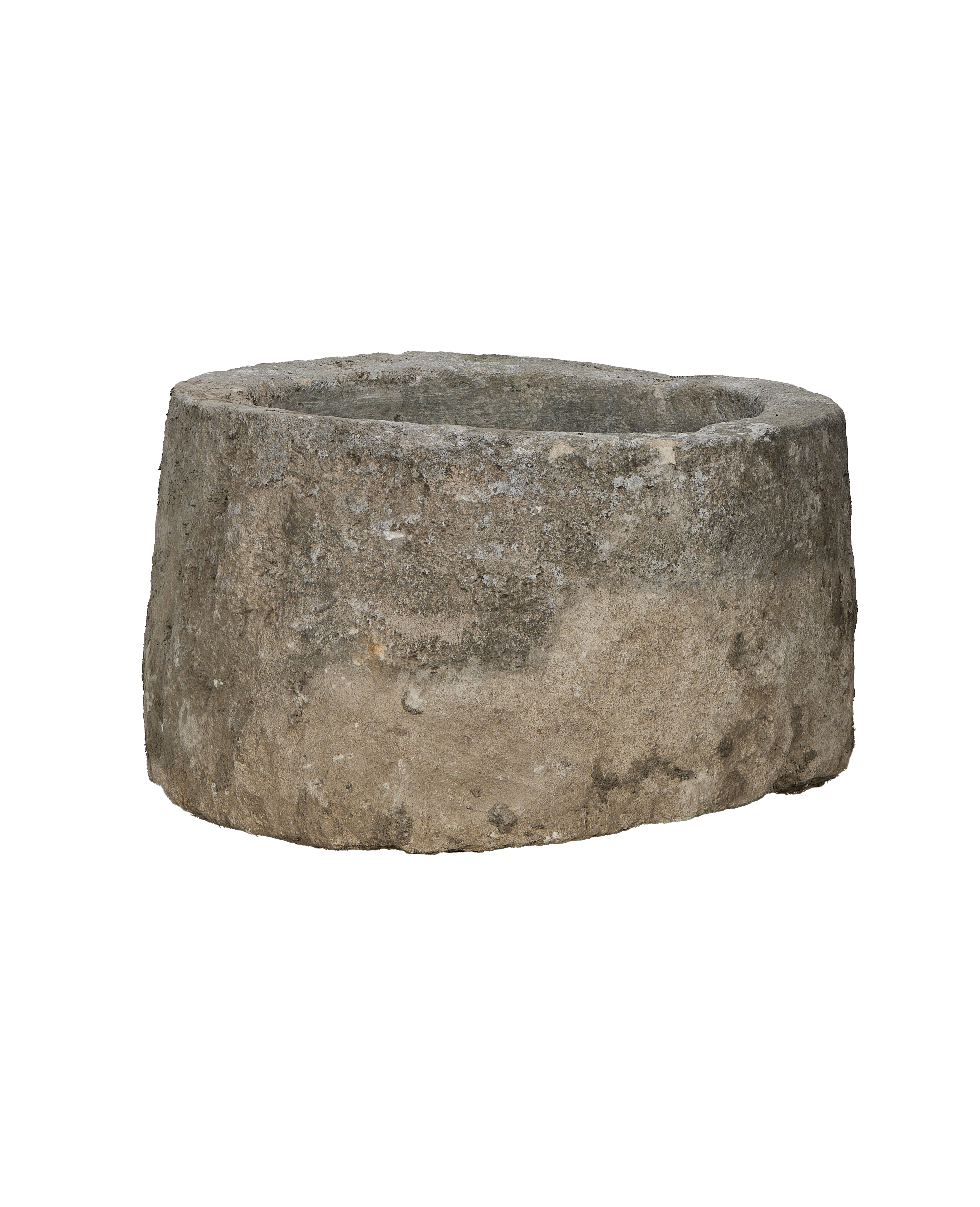 Vintage round limestone trough, lower angle showing weathered texture and natural imperfections.
